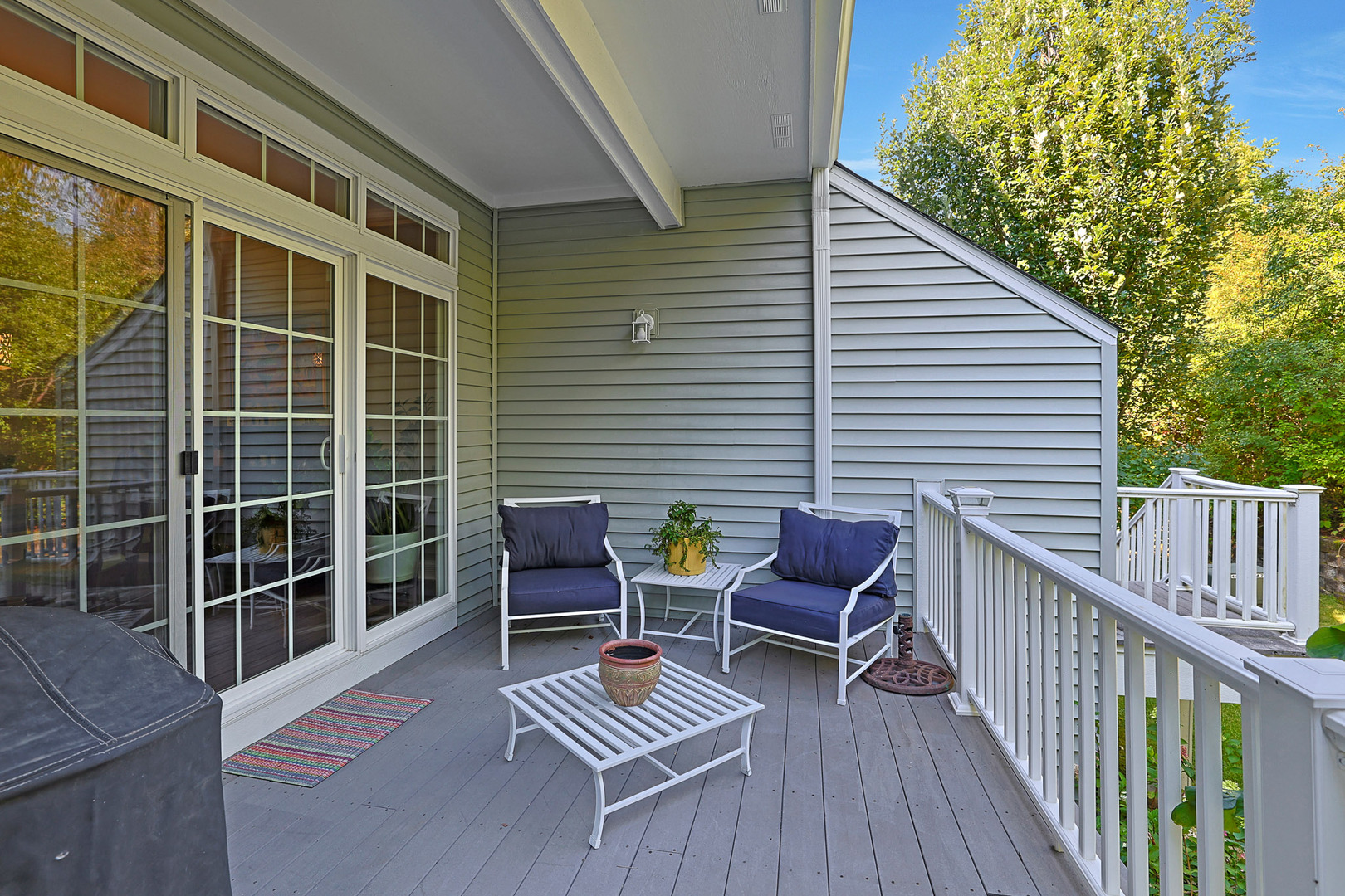 1053 Hummingbird Way Bartlett, IL 60103 - Photo 3 of 6 a balcony with wooden floor and furniture