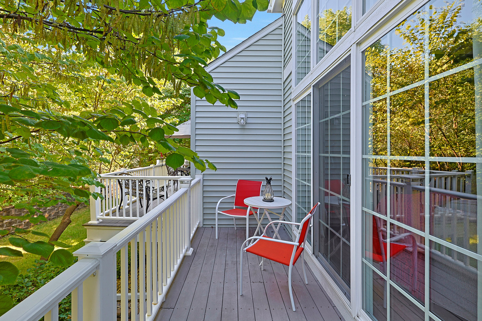 1053 Hummingbird Way Bartlett, IL 60103 - Photo 4 of 6 a balcony with wooden floor and some potted plants