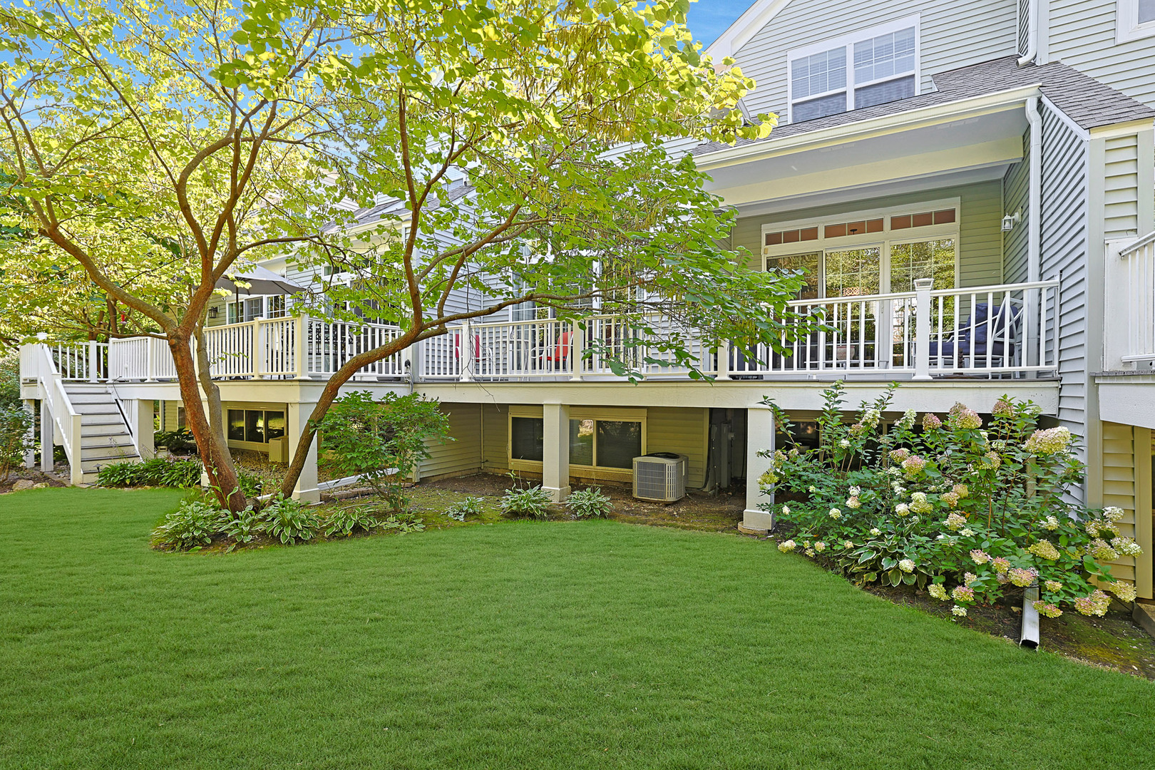 1053 Hummingbird Way Bartlett, IL 60103 - Photo 5 of 6 a front view of a house with garden
