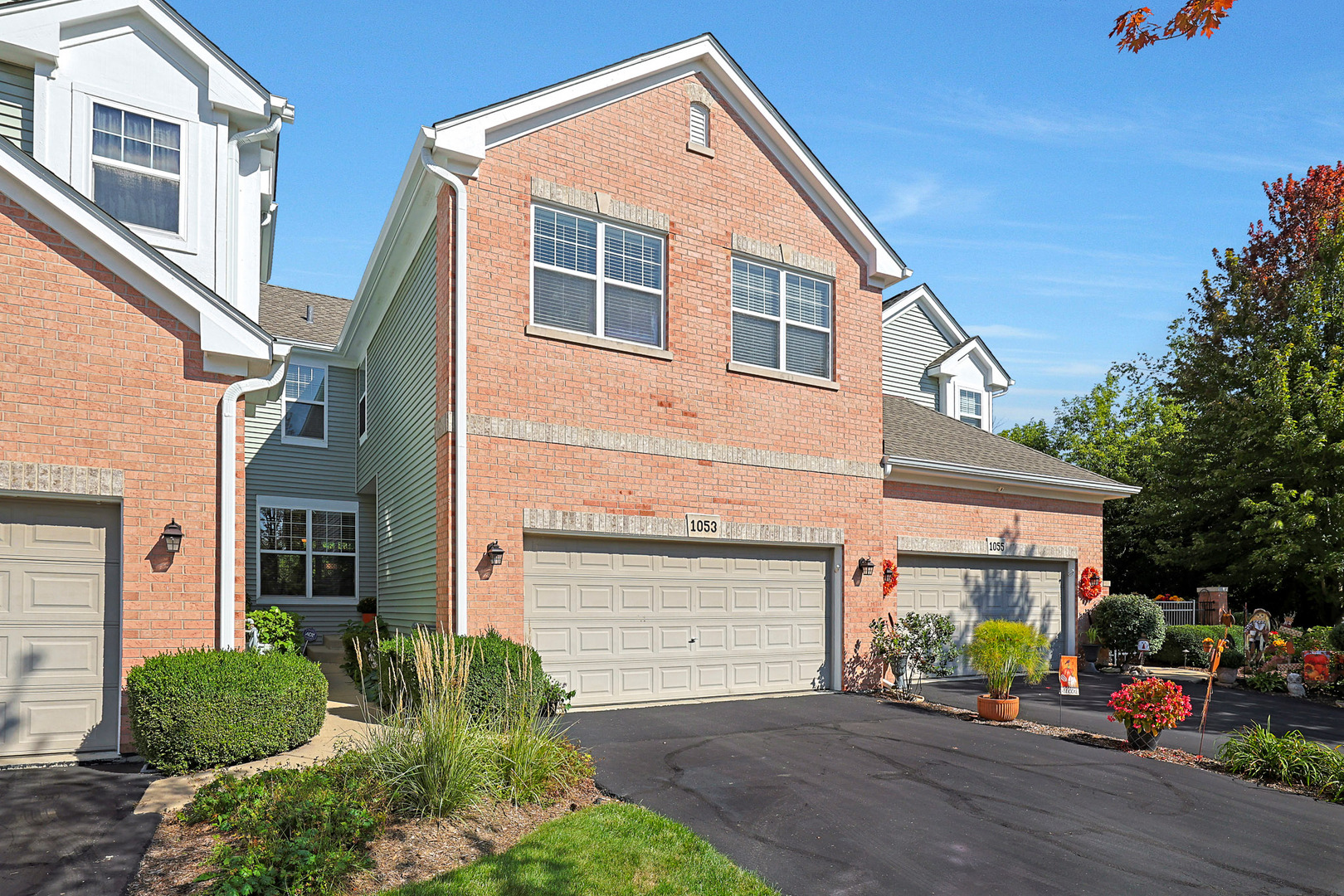 1053 Hummingbird Way Bartlett, IL 60103 - Photo 6 of 6 a front view of a house with a yard and garage