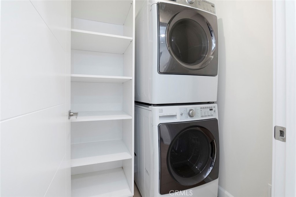 7103 Greeley Street Tujunga, CA 91042 - Photo 11 of 33 a close view of a utility room with dryer and washer