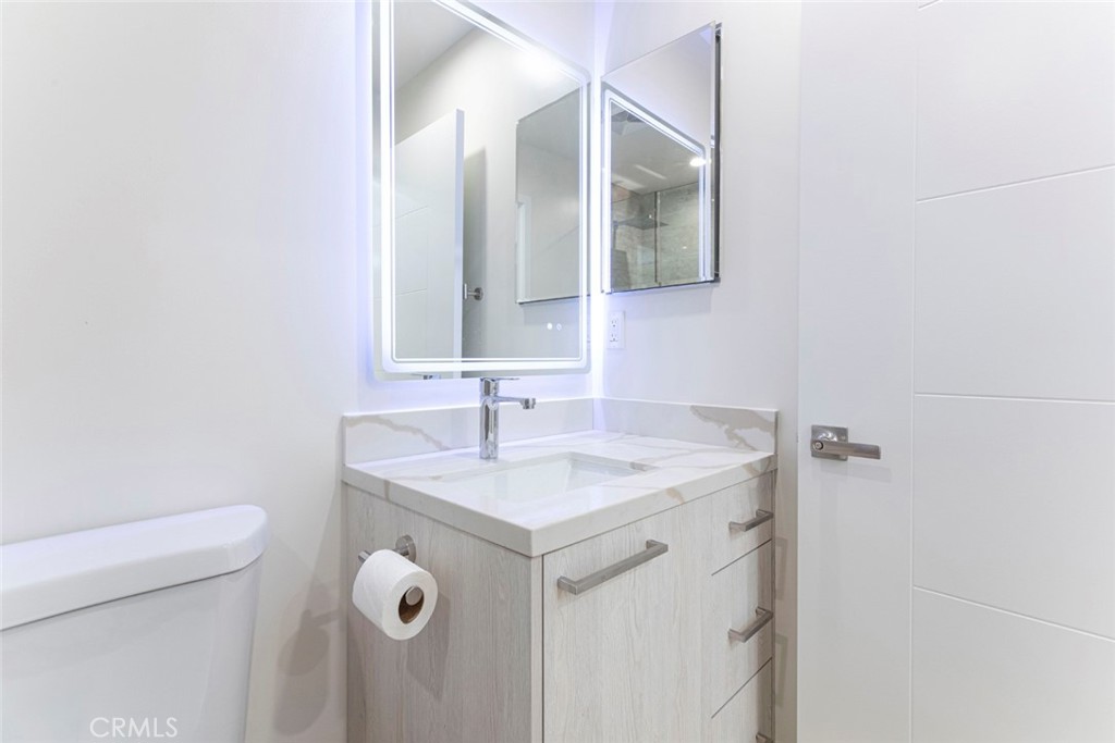 7103 Greeley Street Tujunga, CA 91042 - Photo 13 of 33 a bathroom with a sink and a toilet