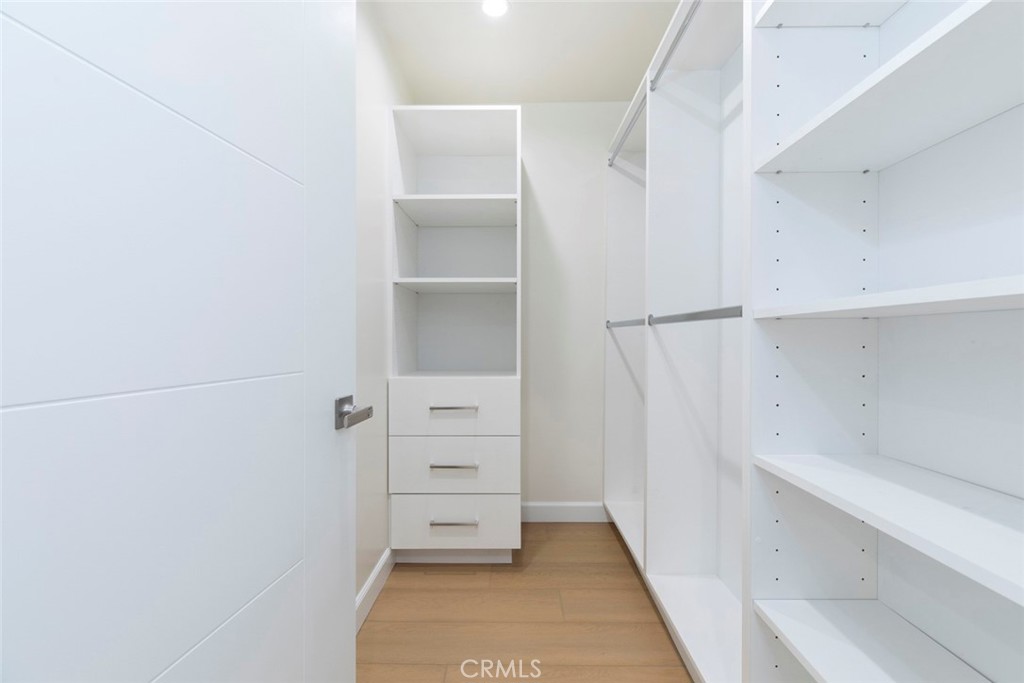 7103 Greeley Street Tujunga, CA 91042 - Photo 16 of 33 a view of walk in closet with empty racks