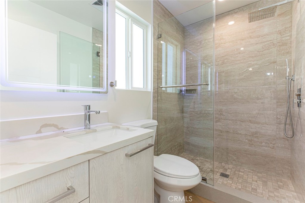 7103 Greeley Street Tujunga, CA 91042 - Photo 17 of 33 a bathroom with a sink a toilet and shower