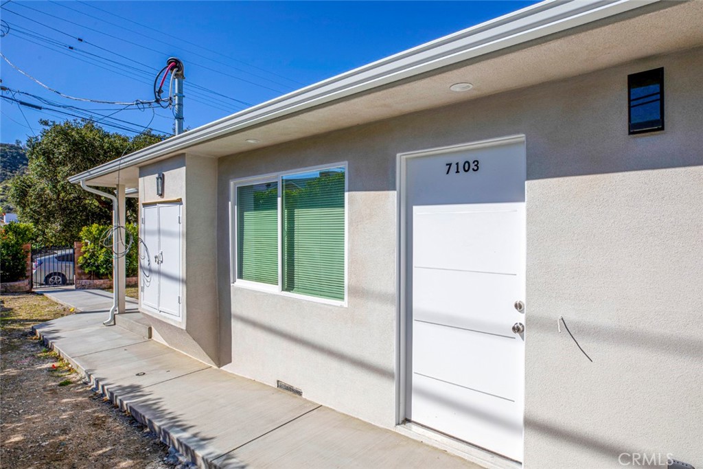 7103 Greeley Street Tujunga, CA 91042 - Photo 2 of 33 a front view of a house with a porch