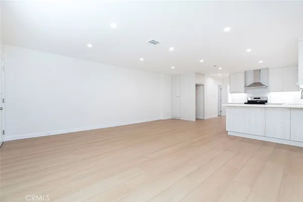 a view of kitchen with wooden floor