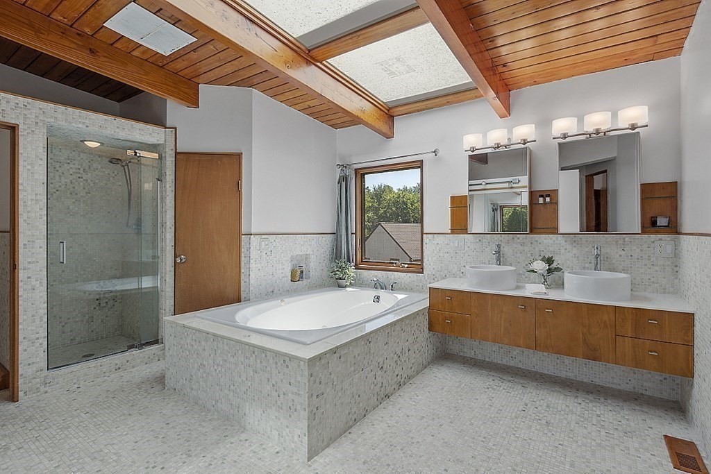 153 Middle Road Boxborough, MA 01719 - Photo 21 of 36 a spacious bathroom with a tub double sink and mirror