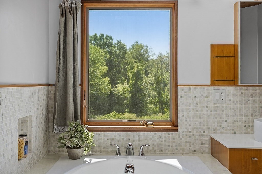 153 Middle Road Boxborough, MA 01719 - Photo 23 of 36 a bathroom with a bathtub and shower