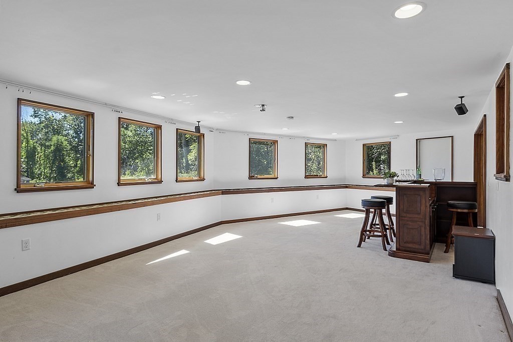 153 Middle Road Boxborough, MA 01719 - Photo 26 of 36 a view of a big room with windows and furniture