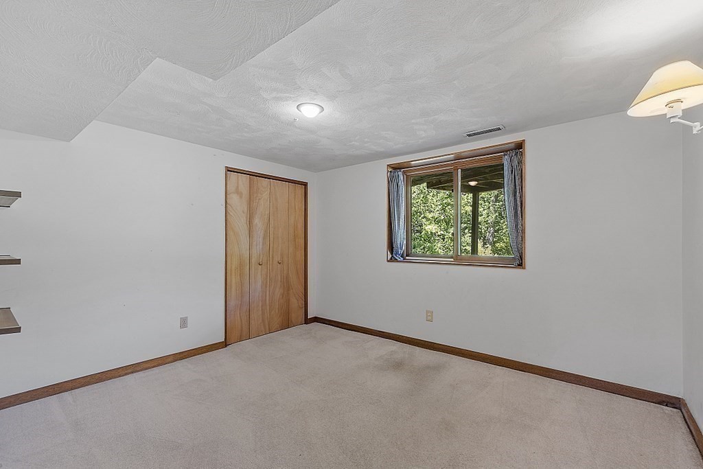 153 Middle Road Boxborough, MA 01719 - Photo 33 of 36 an empty room with windows
