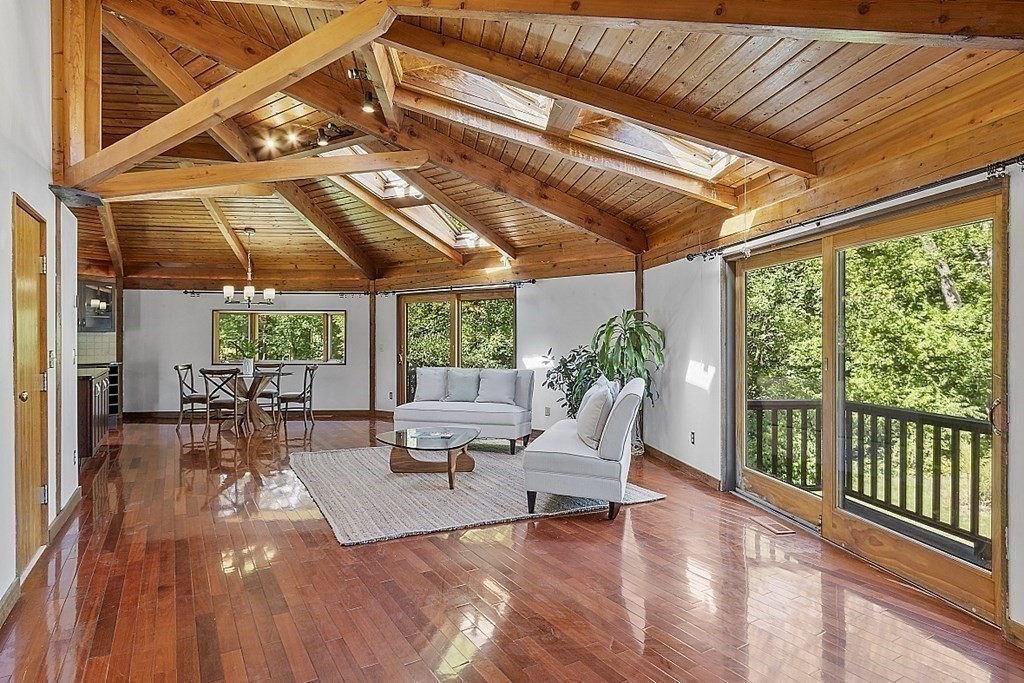 153 Middle Road Boxborough, MA 01719 - Photo 8 of 36 a living room with furniture and a large window