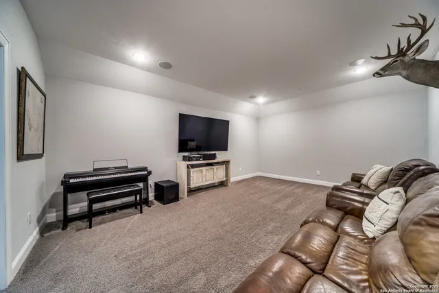 a room with furniture and a flat screen tv