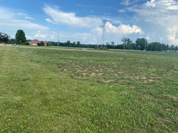 a view of a lake with a big yard