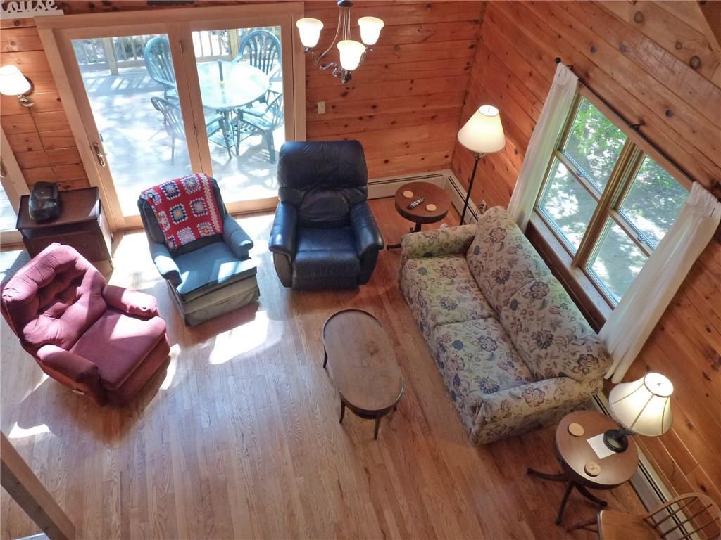 75 Brooks And Dunn Road Otis, ME 04605 - Photo 17 of 35 View of living room from loft.