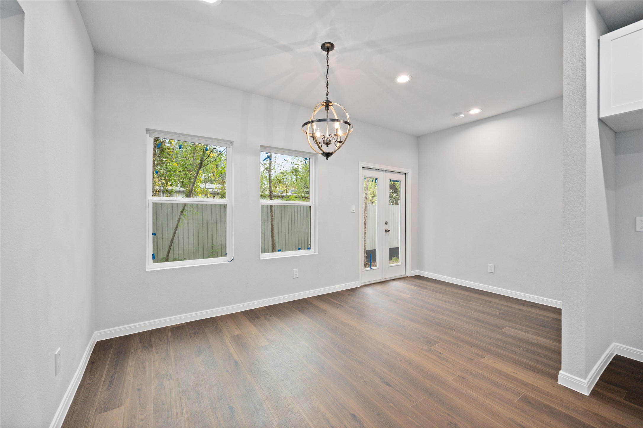 18831 Luminescent Ln Spring Spring, TX 77379 - Photo 11 of 36 a view of an empty room with wooden floor and window