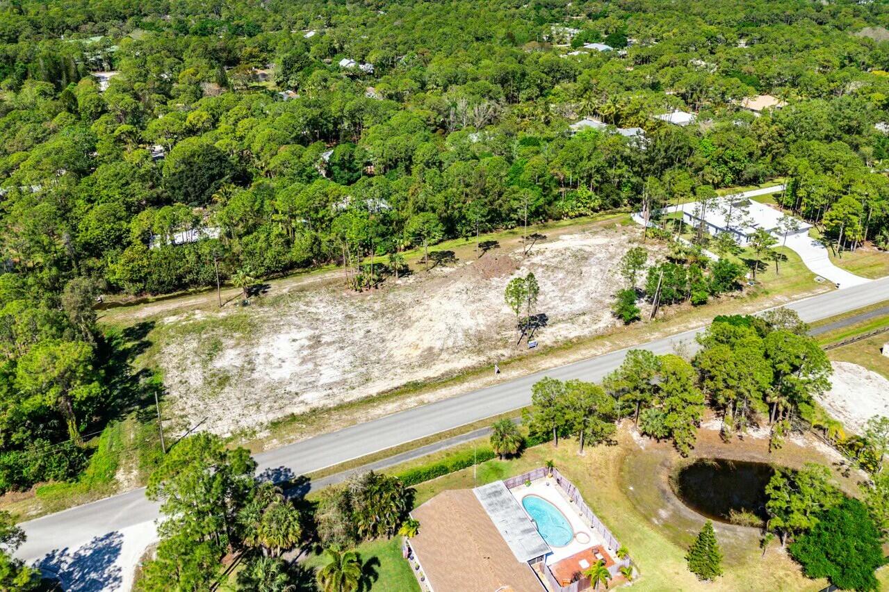 7160 Mellen Lane North Jupiter, FL 33478 - Photo 13 of 15 a view of a yard with plants