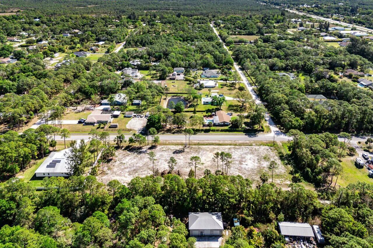 7160 Mellen Lane North Jupiter, FL 33478 - Photo 7 of 15 an aerial view of residential houses with outdoor space