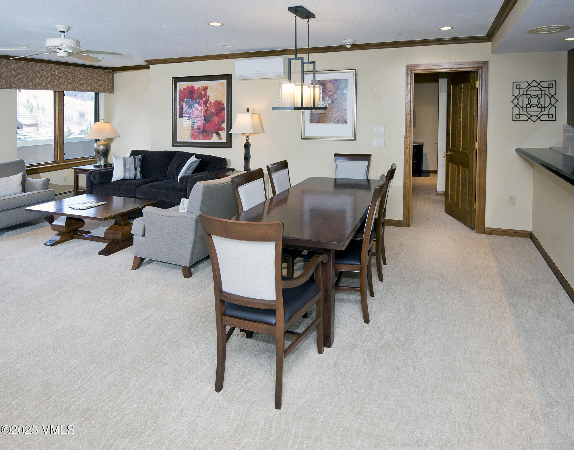 210 Offerson Road, Unit 321 Beaver Creek, CO 81620 - Photo 15 of 30 a living room with furniture and a chandelier