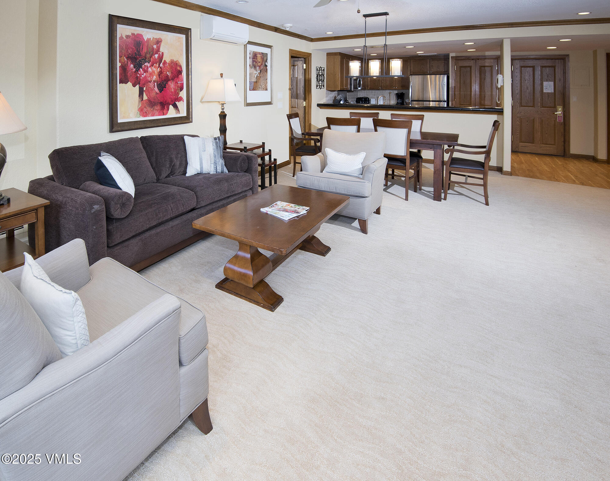 210 Offerson Road, Unit 321 Beaver Creek, CO 81620 - Photo 16 of 30 a living room with furniture and a kitchen