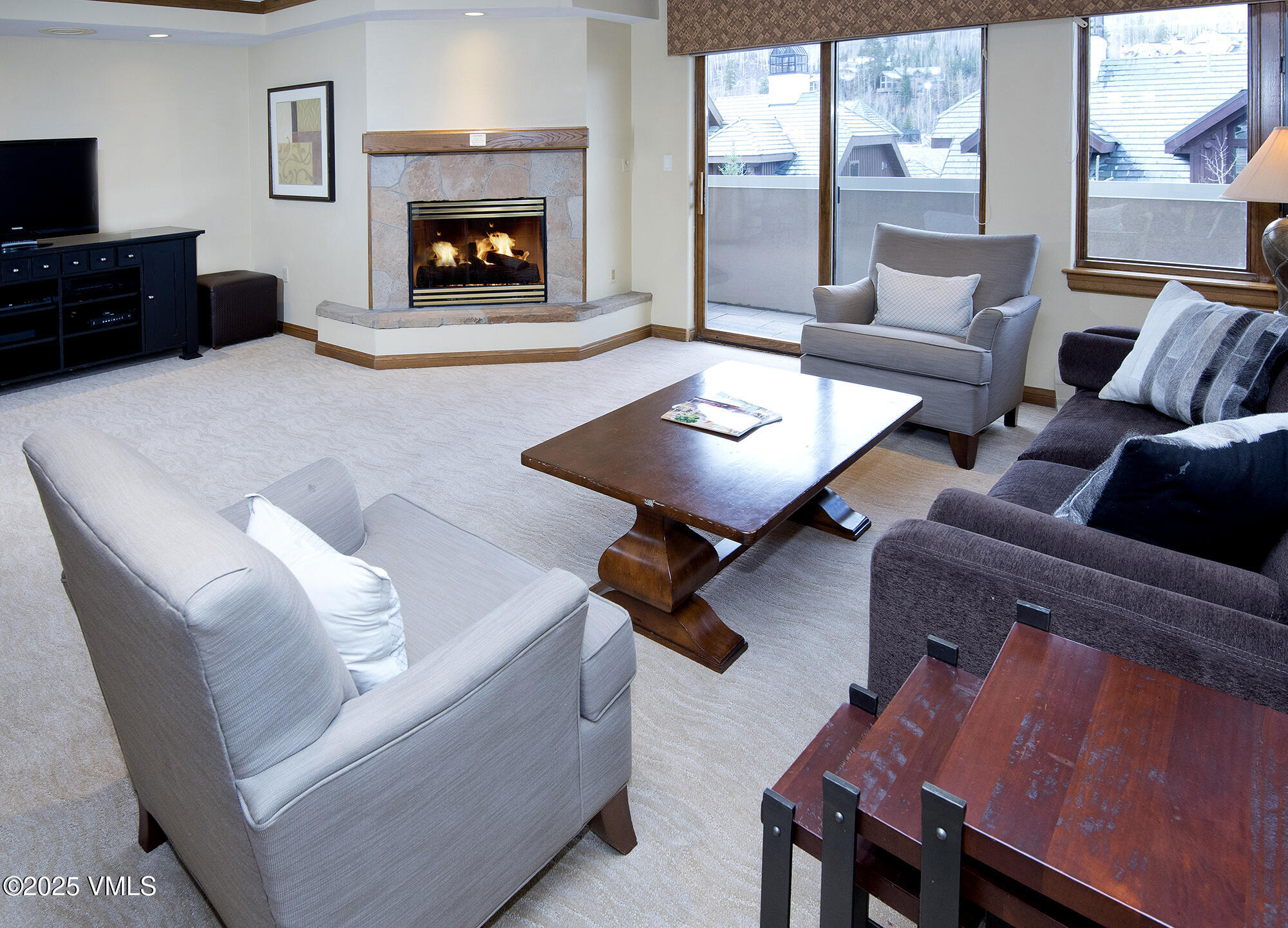 210 Offerson Road, Unit 321 Beaver Creek, CO 81620 - Photo 17 of 30 a living room with furniture and a fireplace