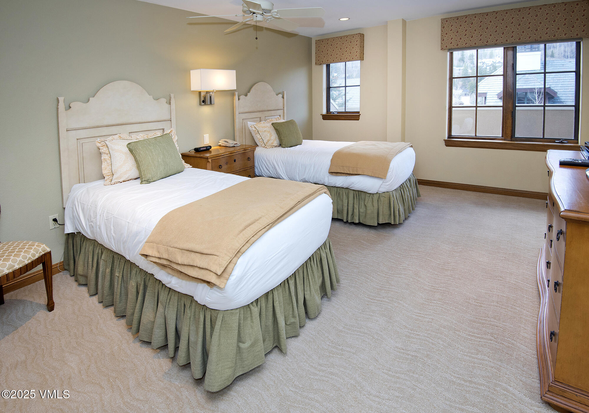 210 Offerson Road, Unit 321 Beaver Creek, CO 81620 - Photo 28 of 30 a bedroom with two beds and a large window