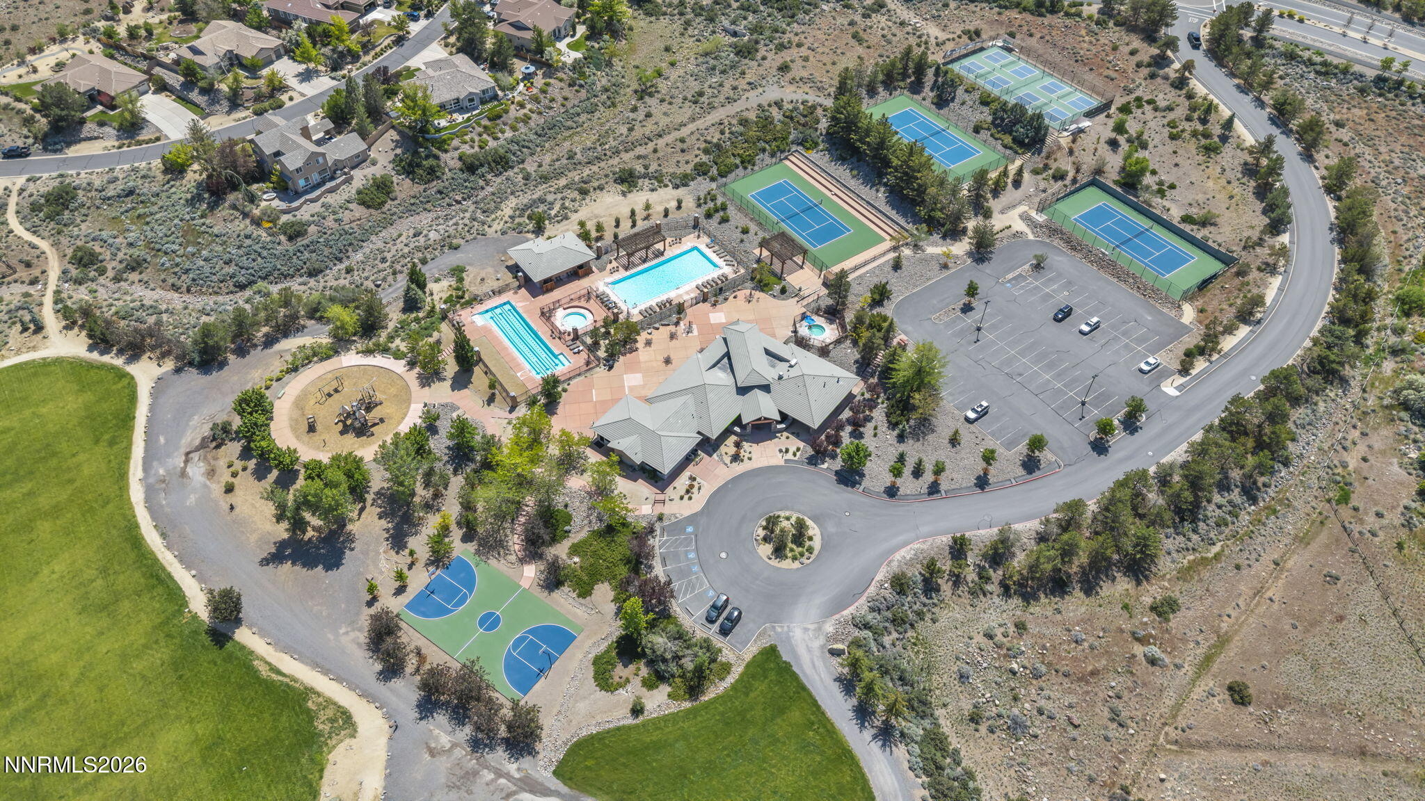 574 Echo Ridge Court Reno, NV 89511 - Photo 52 of 58 an aerial view of a swimming pool with outdoor seating and yard