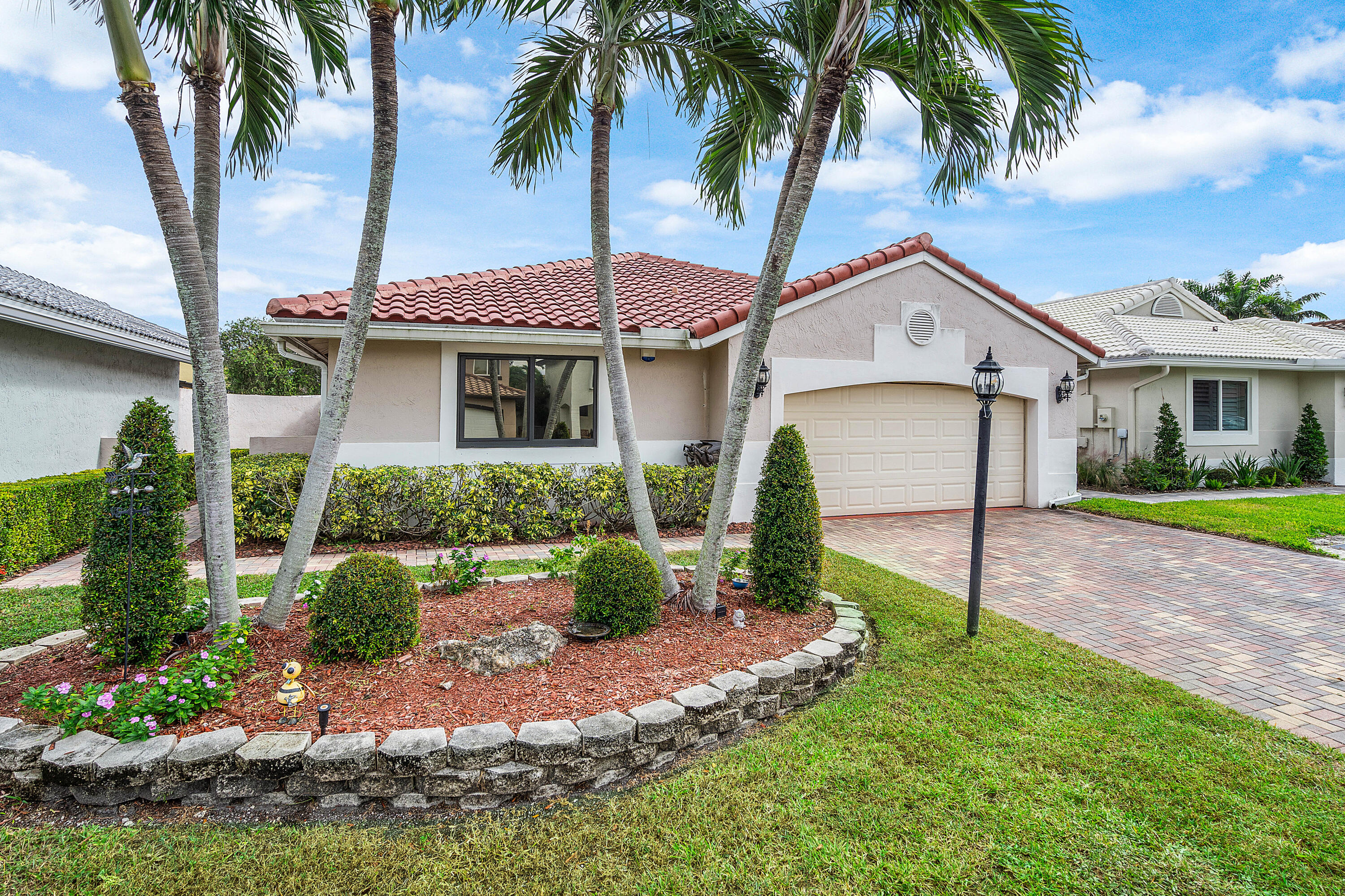 6100 Manchester Lane Davie, FL 33331 - Photo 1 of 30 a front view of a house with a garden