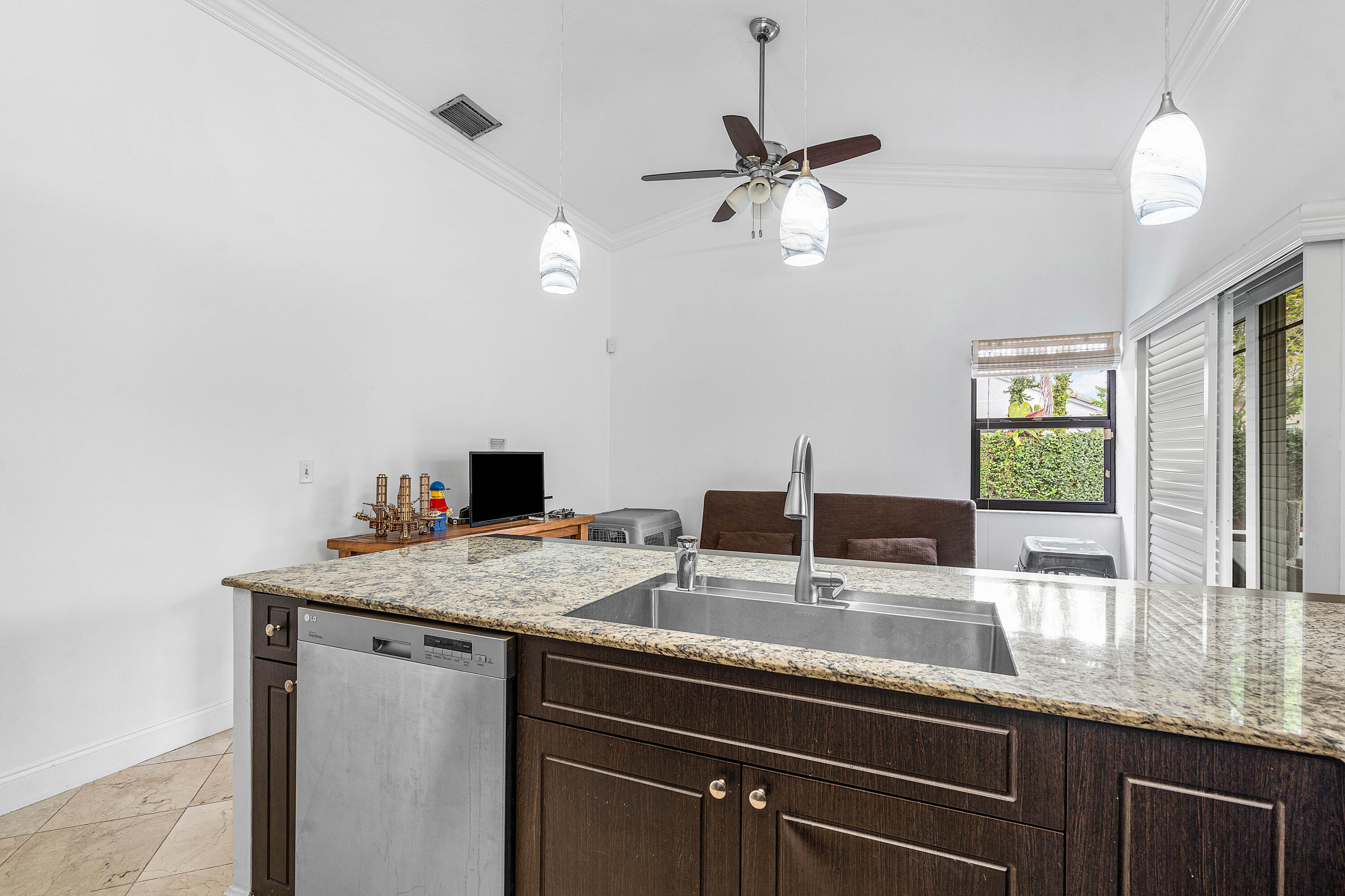 6100 Manchester Lane Davie, FL 33331 - Photo 15 of 30 a kitchen with a sink and a mirror