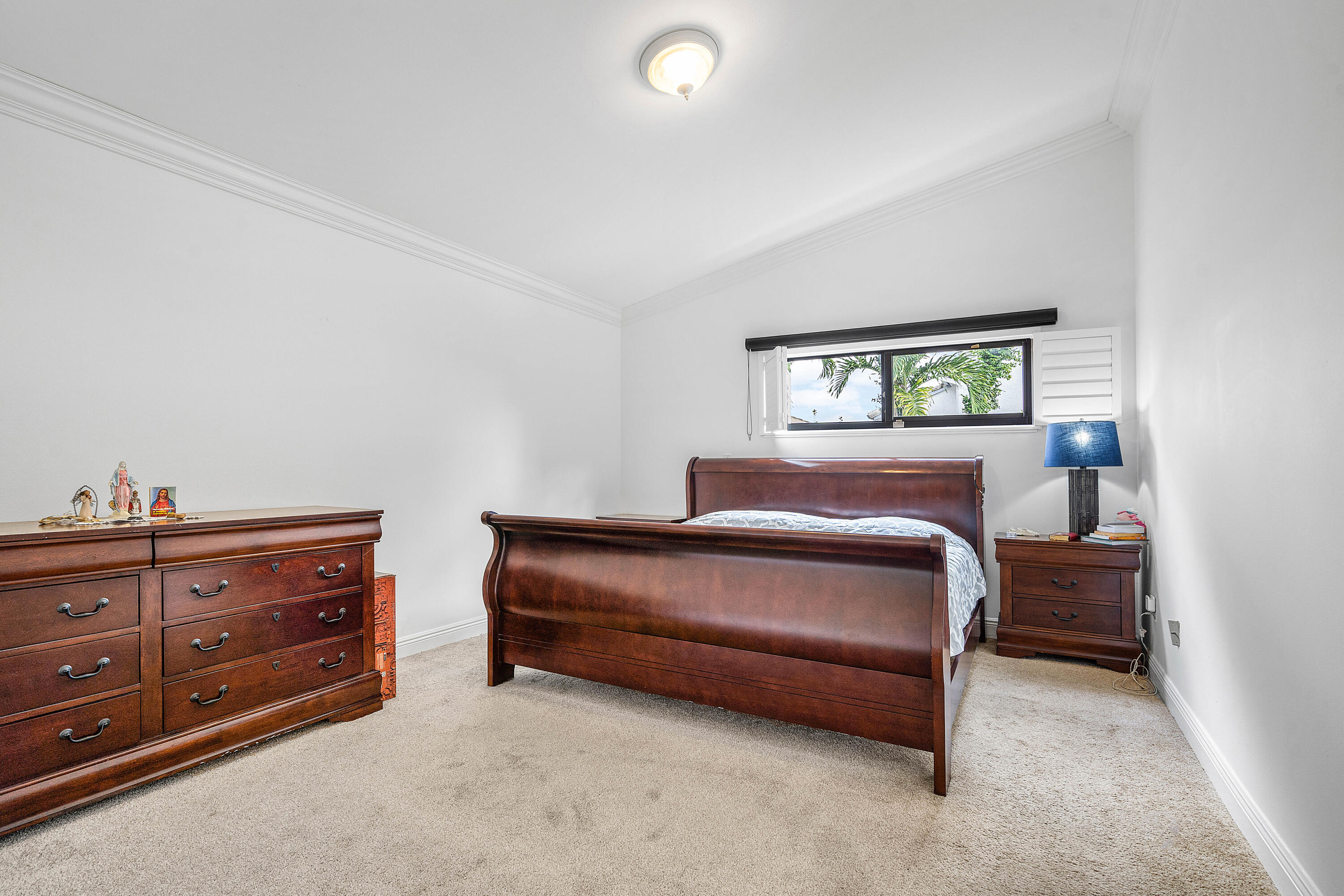 6100 Manchester Lane Davie, FL 33331 - Photo 18 of 30 a bedroom with a bed and a dresser