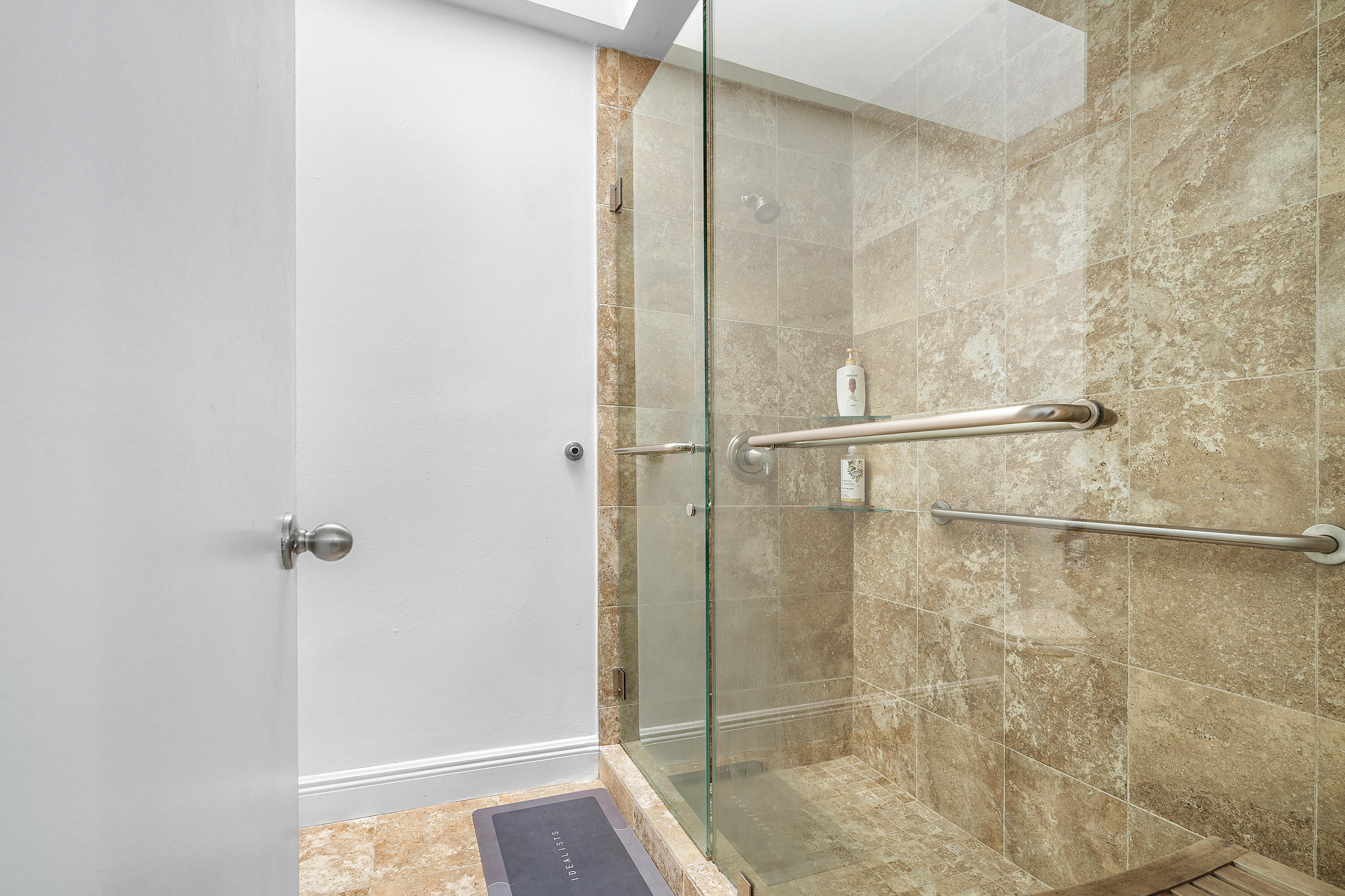 6100 Manchester Lane Davie, FL 33331 - Photo 20 of 30 a bathroom with a glass shower door