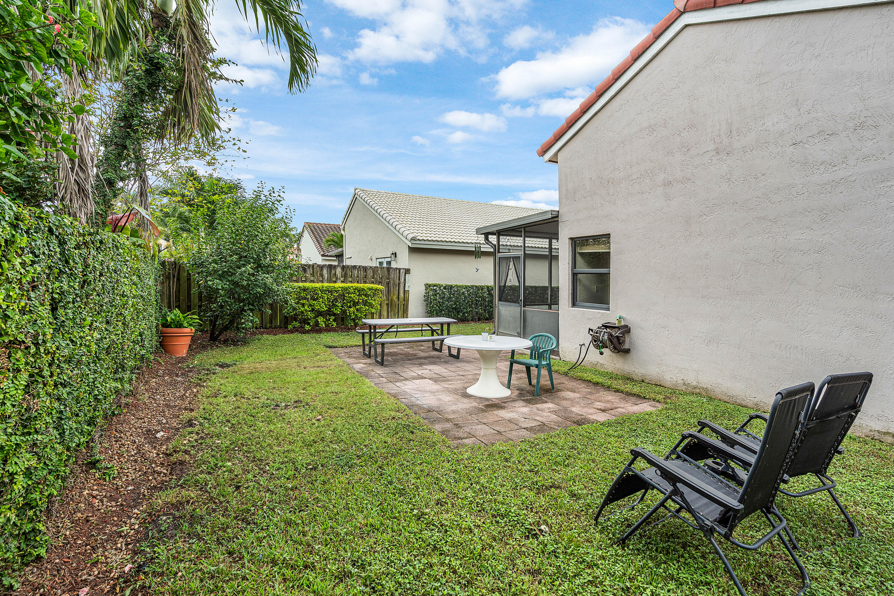6100 Manchester Lane Davie, FL 33331 - Photo 29 of 30 a view of a backyard with sitting area