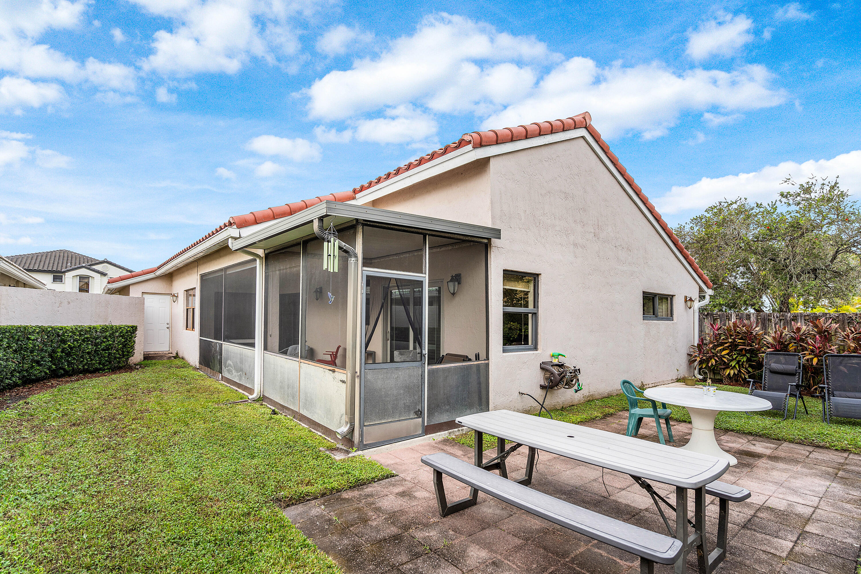 6100 Manchester Lane Davie, FL 33331 - Photo 30 of 30 a view of a chair and table in backyard of the house