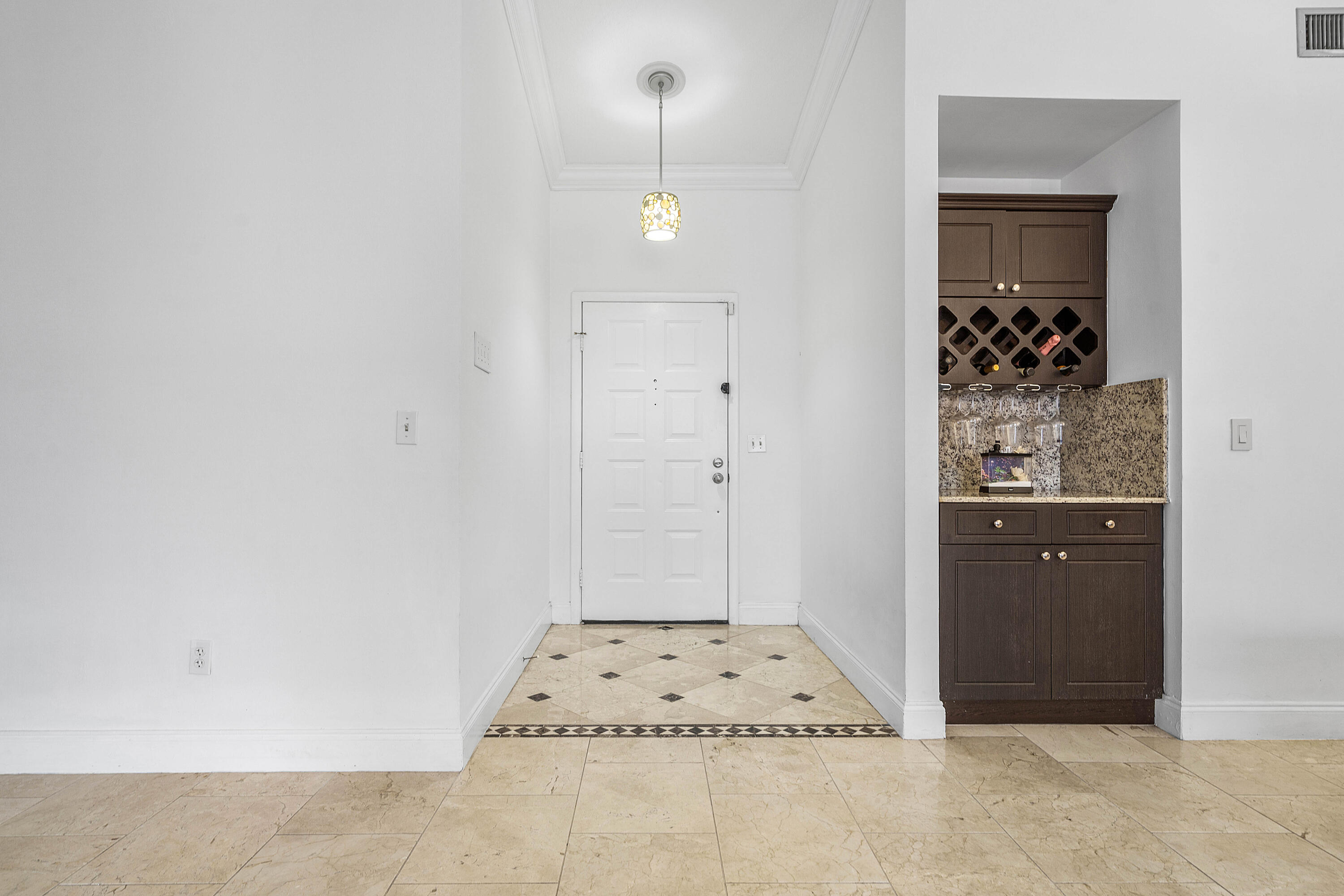 6100 Manchester Lane Davie, FL 33331 - Photo 6 of 30 a view of a hallway with cabinet and mirror