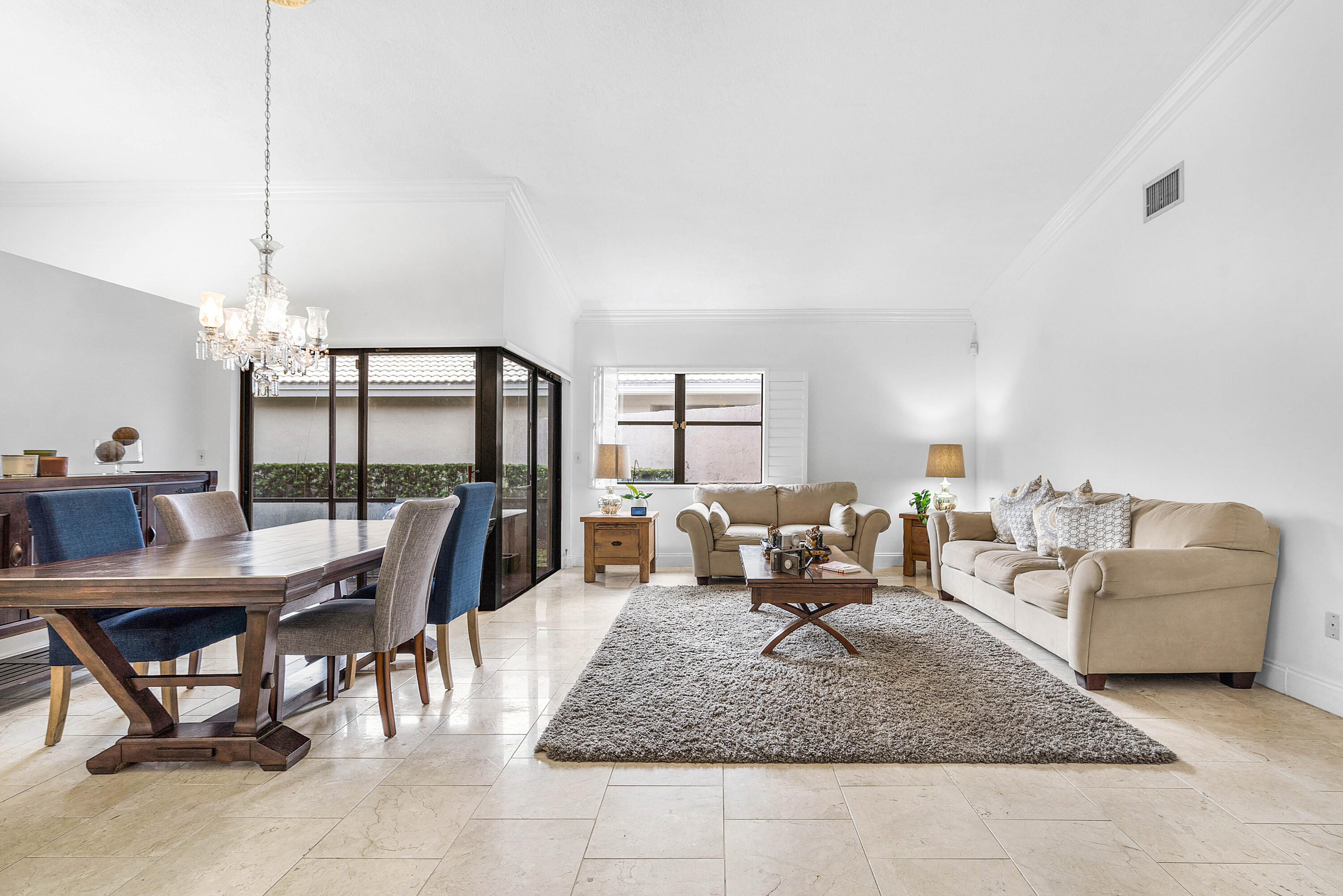 6100 Manchester Lane Davie, FL 33331 - Photo 7 of 30 a living room with furniture and a floor to ceiling window