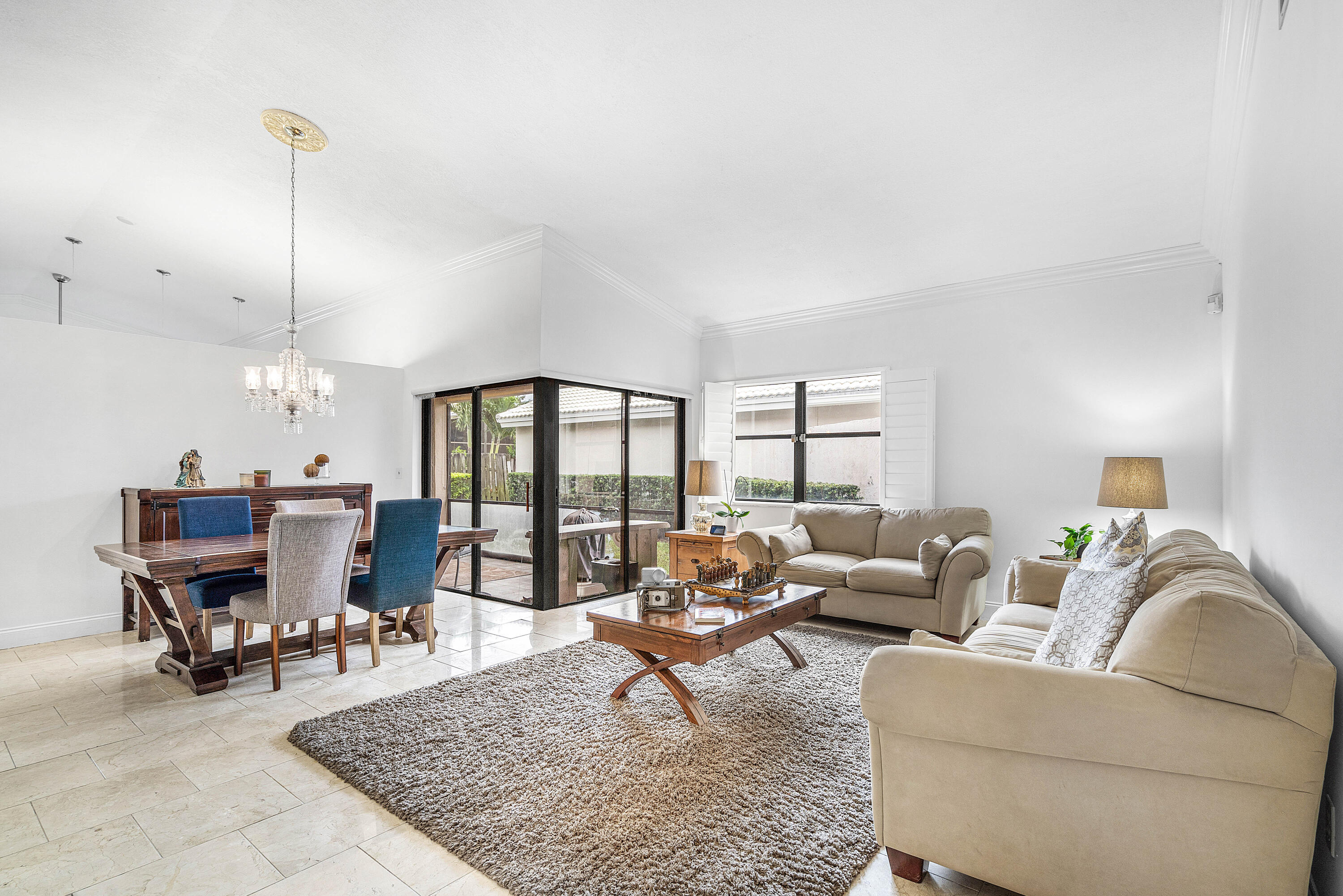 6100 Manchester Lane Davie, FL 33331 - Photo 8 of 30 a living room with furniture large window and a table