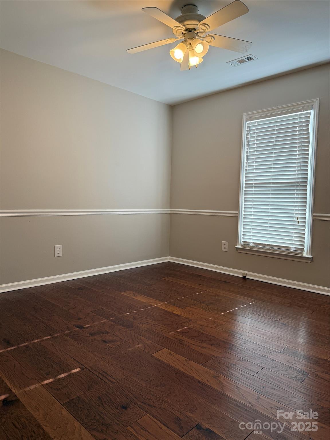2238 Swain Court Gastonia, NC 28054 - Photo 12 of 27 an empty room with wooden floor and windows
