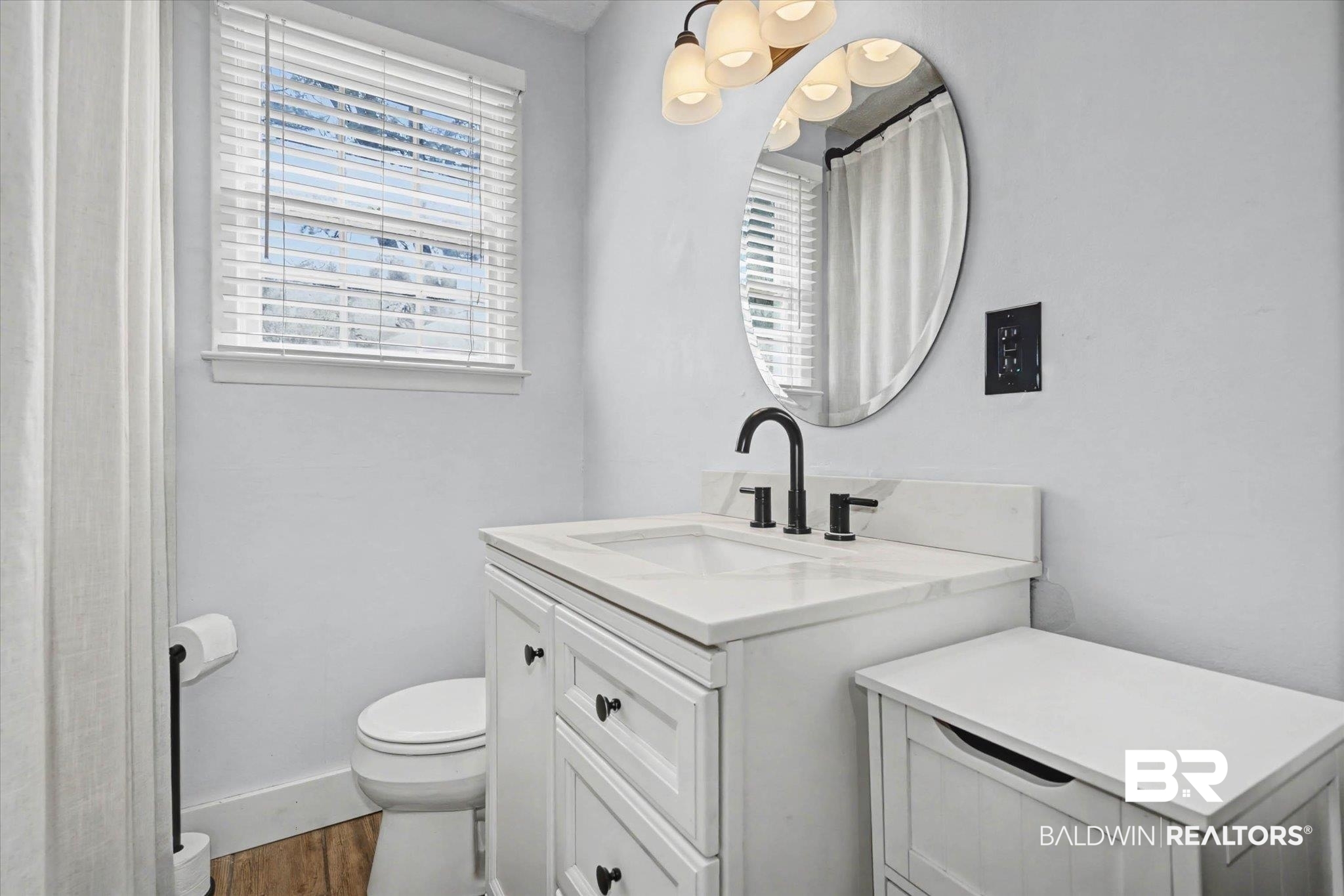 5117 Norton Lane Mobile, AL 36608 - Photo 16 of 35 Bathroom featuring vanity, dark wood-style flooring, and a shower with curtain
