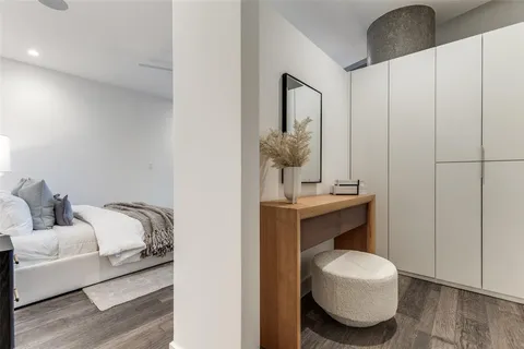 a white bath tub sitting next to a shower