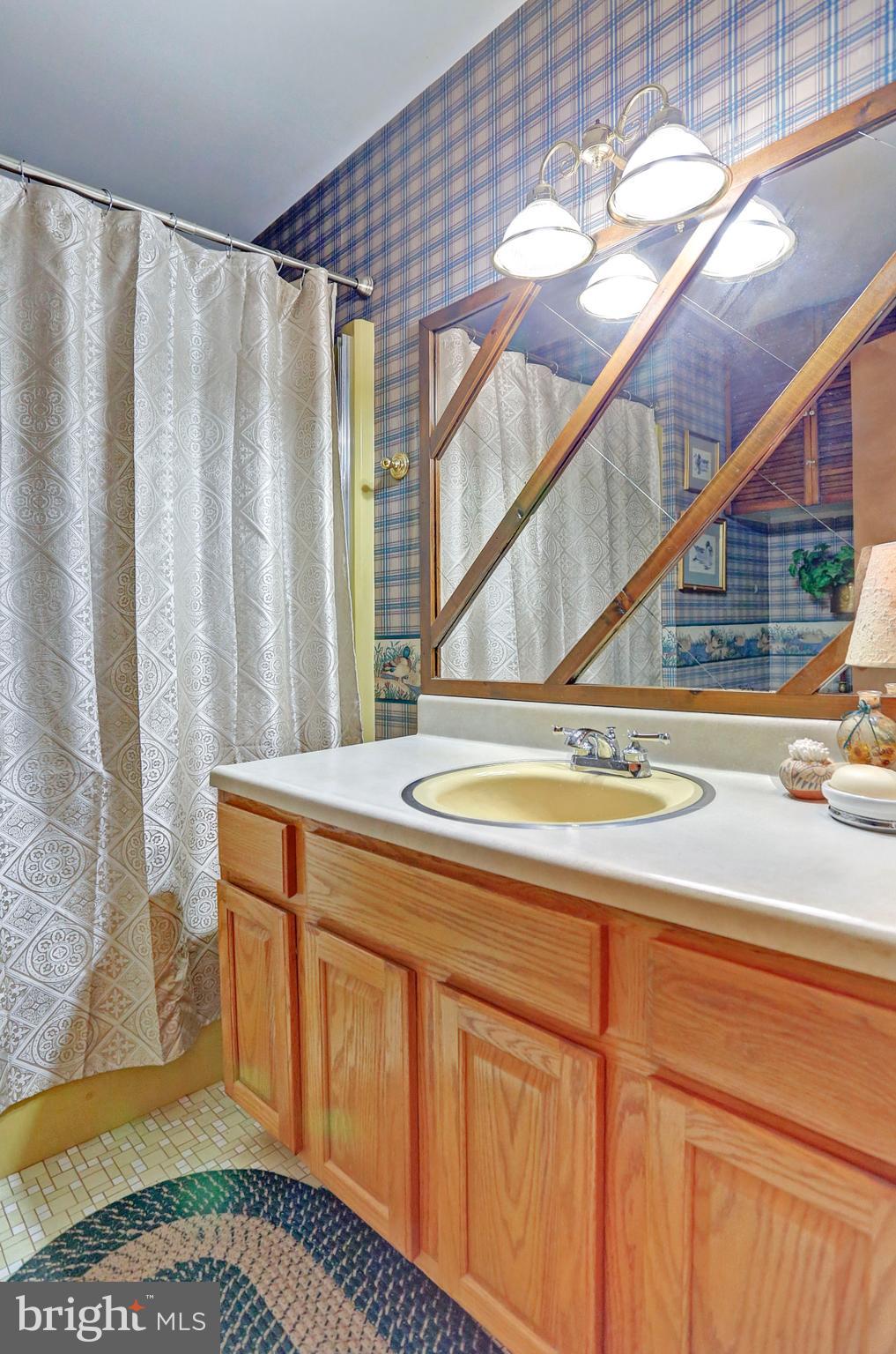 3644 Water Tank Road Manchester, MD 21102 - Photo 11 of 37 a view of a kitchen with kitchen island and wooden floor