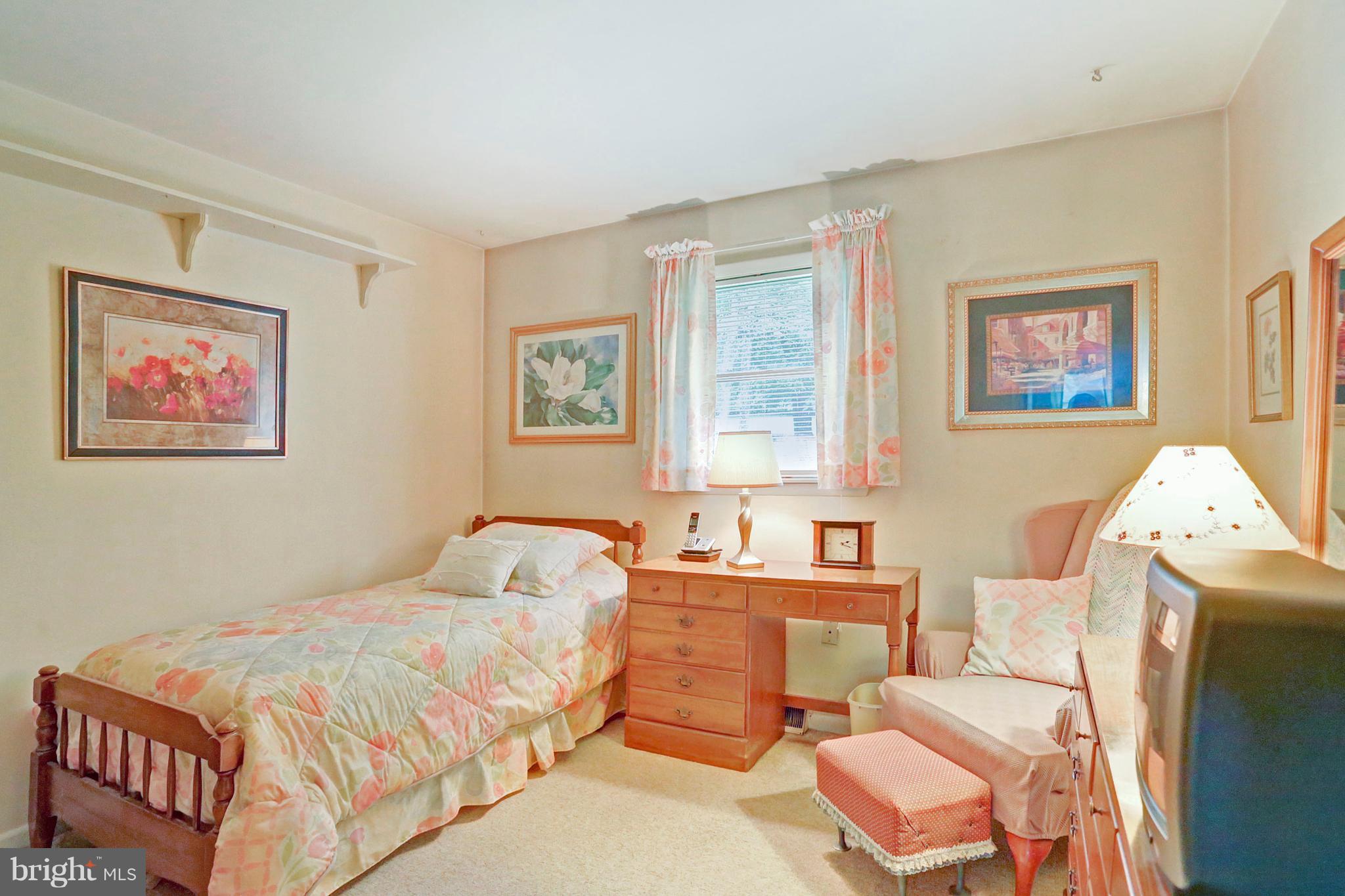 3644 Water Tank Road Manchester, MD 21102 - Photo 16 of 37 a bedroom with a bed and a painting on the wall