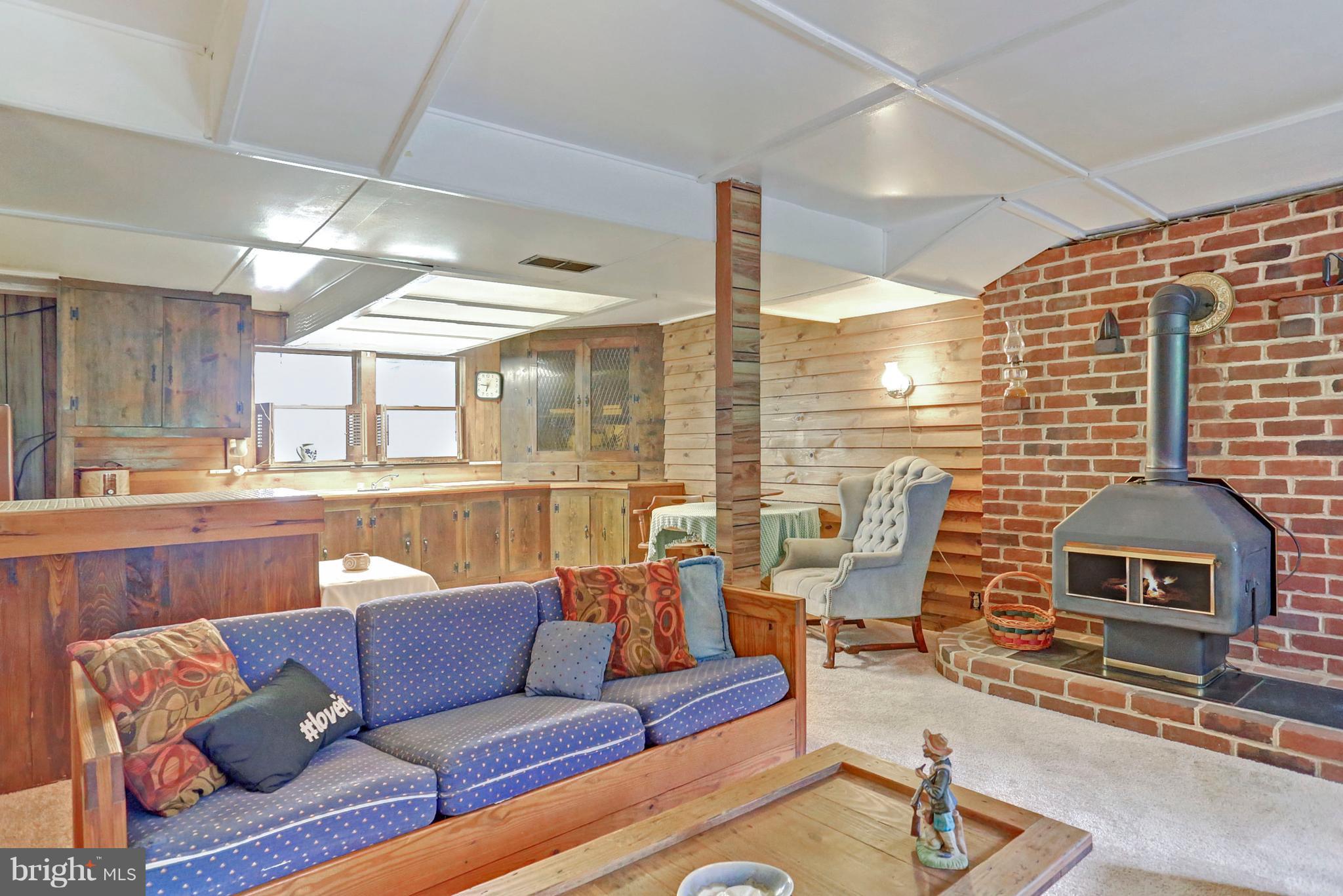 3644 Water Tank Road Manchester, MD 21102 - Photo 21 of 37 a living room with furniture and a fireplace
