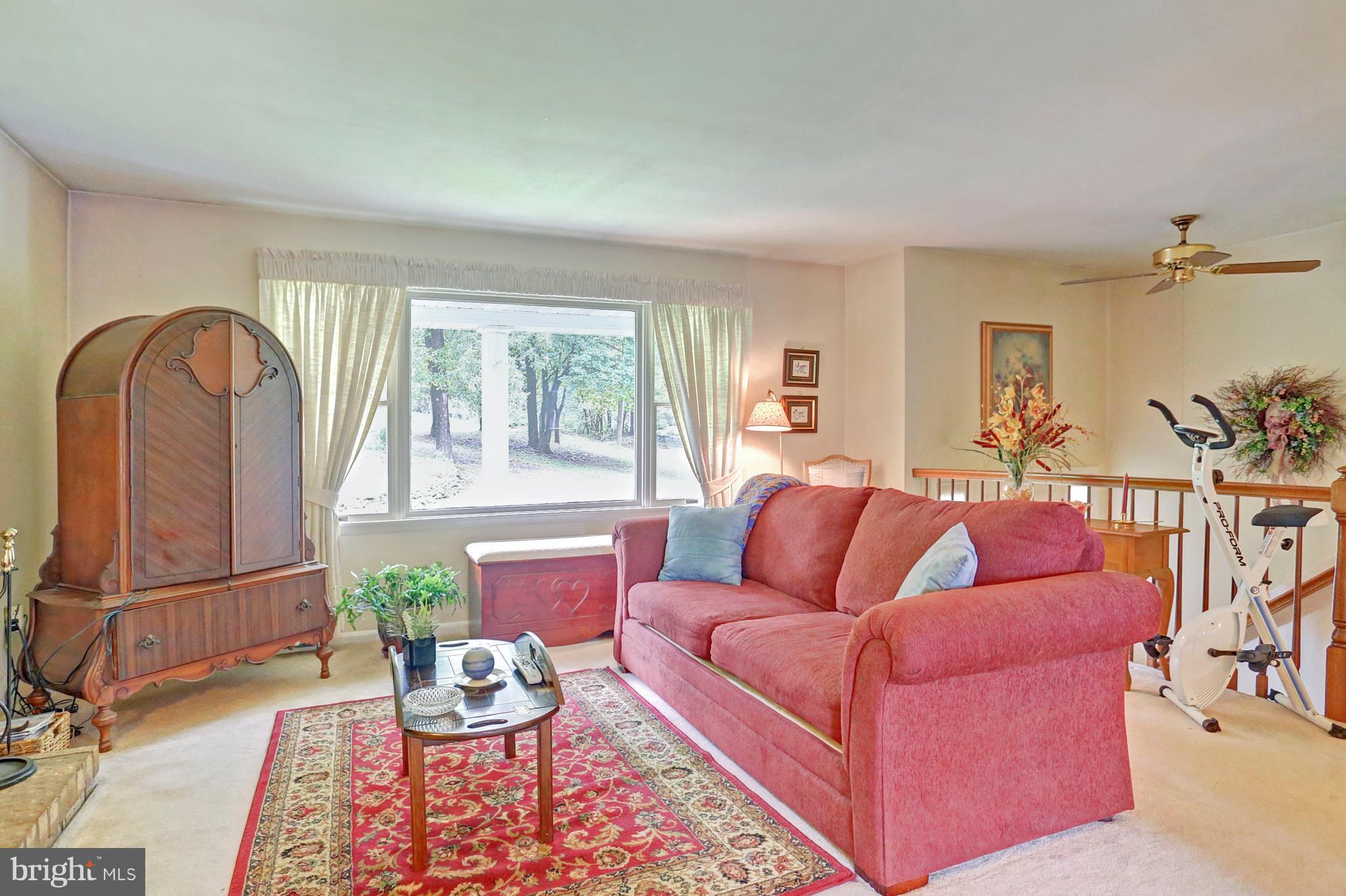 3644 Water Tank Road Manchester, MD 21102 - Photo 25 of 37 a living room with furniture and a window