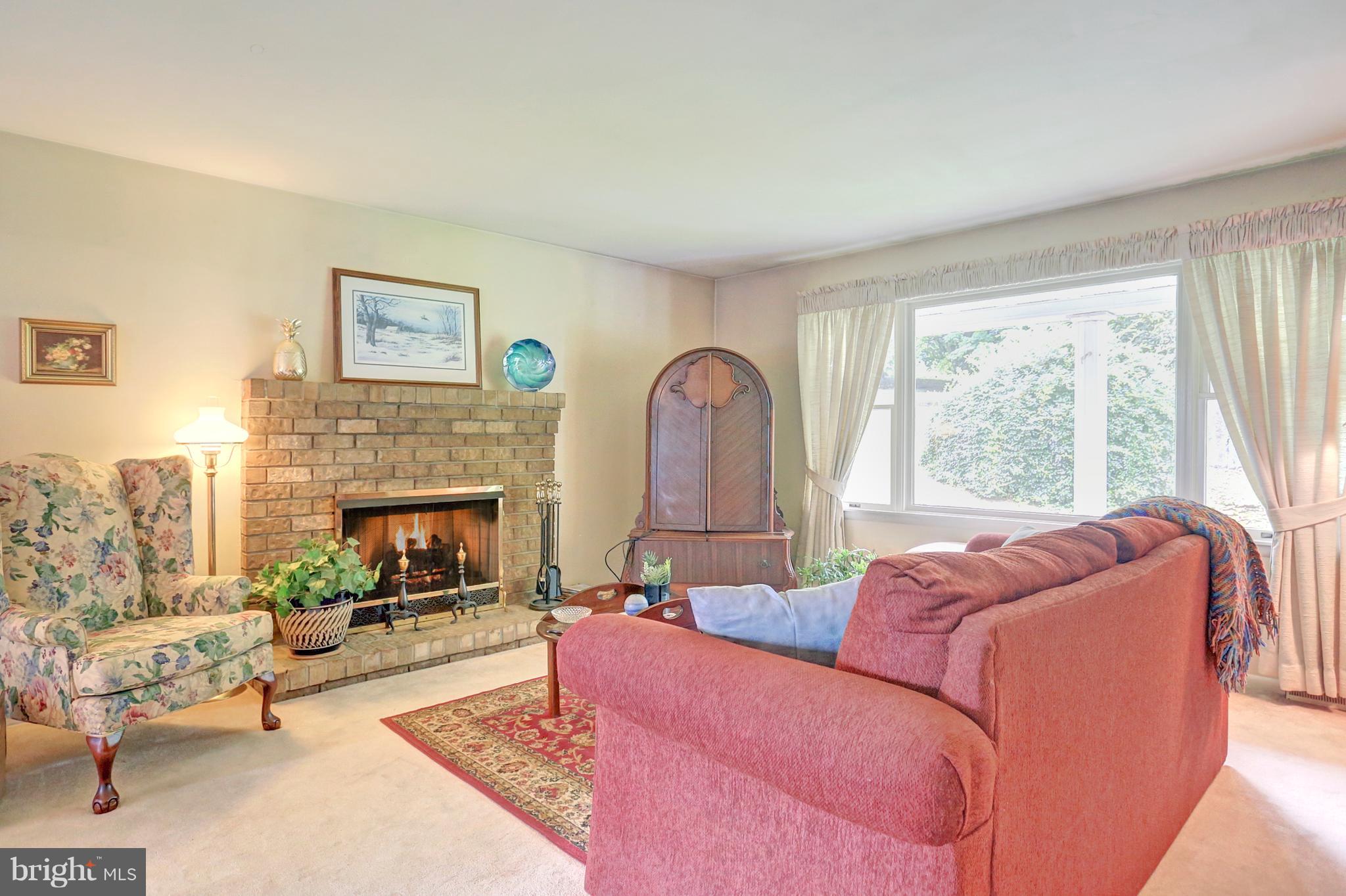 3644 Water Tank Road Manchester, MD 21102 - Photo 26 of 37 a living room with furniture and a fireplace