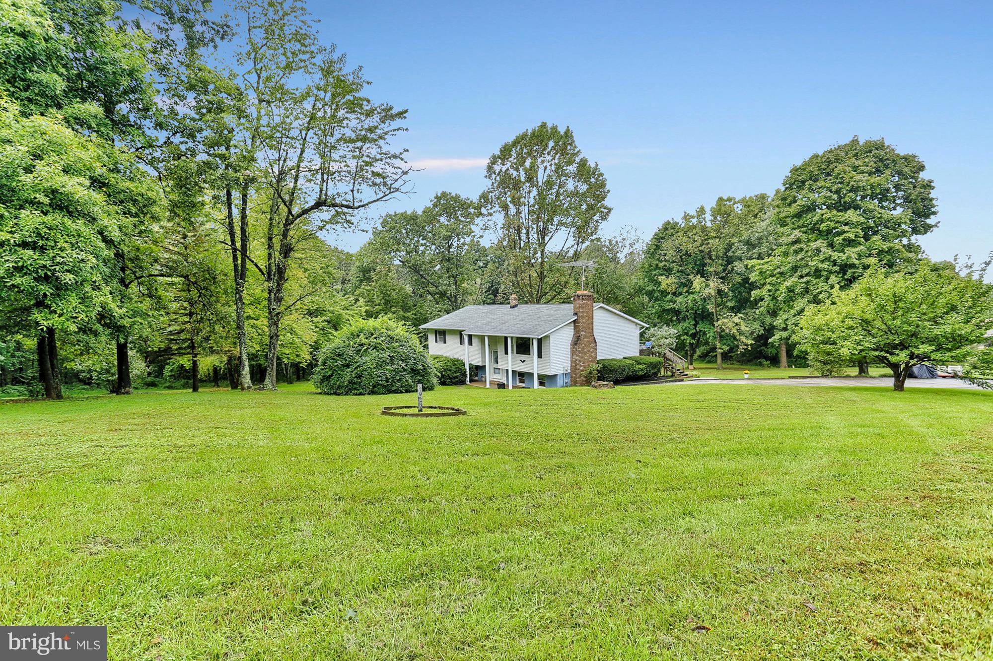 3644 Water Tank Road Manchester, MD 21102 - Photo 29 of 37 a front view of a house with a garden