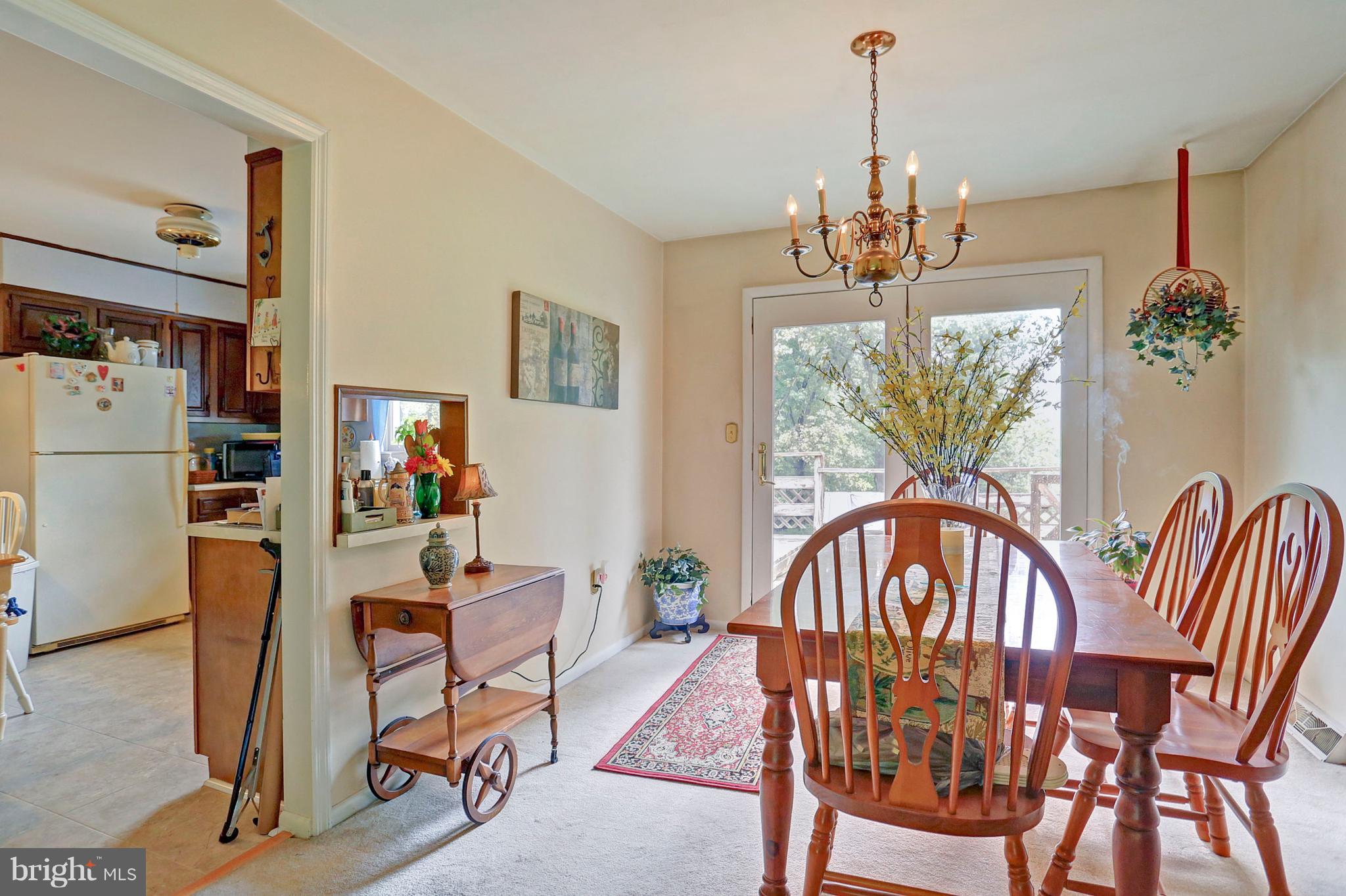 3644 Water Tank Road Manchester, MD 21102 - Photo 5 of 37 a view of a dining room with furniture window and wooden floor