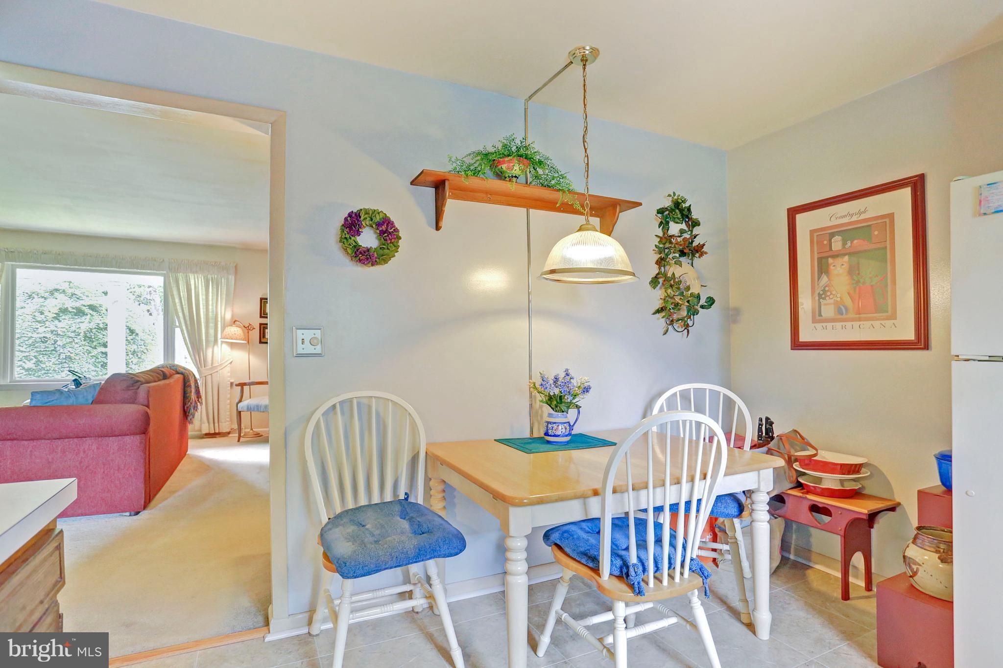 3644 Water Tank Road Manchester, MD 21102 - Photo 7 of 37 a dining room with furniture a chandelier and wooden floor