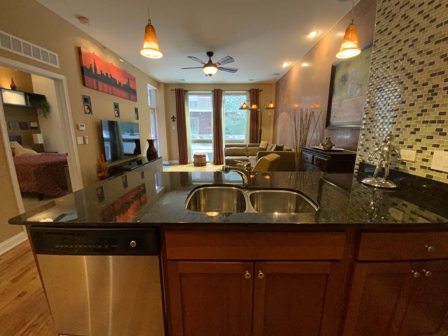 2025 South Indiana Avenue, Unit 209 Chicago, IL 60616 - Photo 24 of 49 a view of living room with kitchen island granite countertop furniture and a flat screen tv