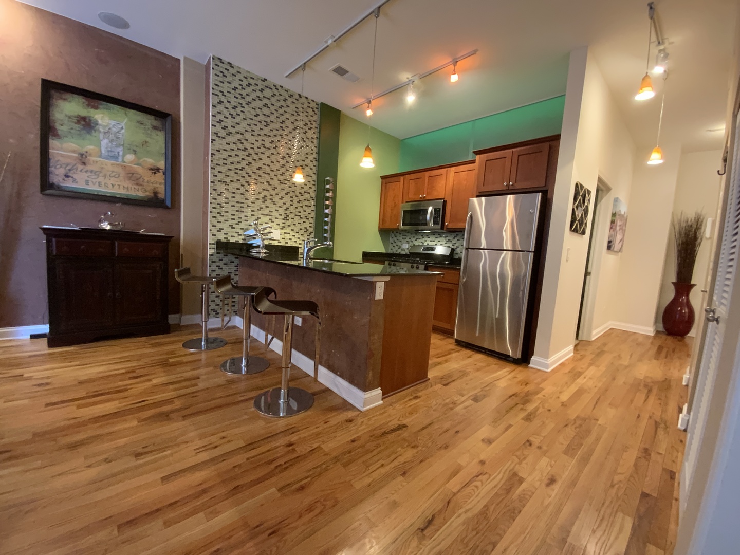 2025 South Indiana Avenue, Unit 209 Chicago, IL 60616 - Photo 25 of 49 a view of a kitchen with furniture and a refrigerator