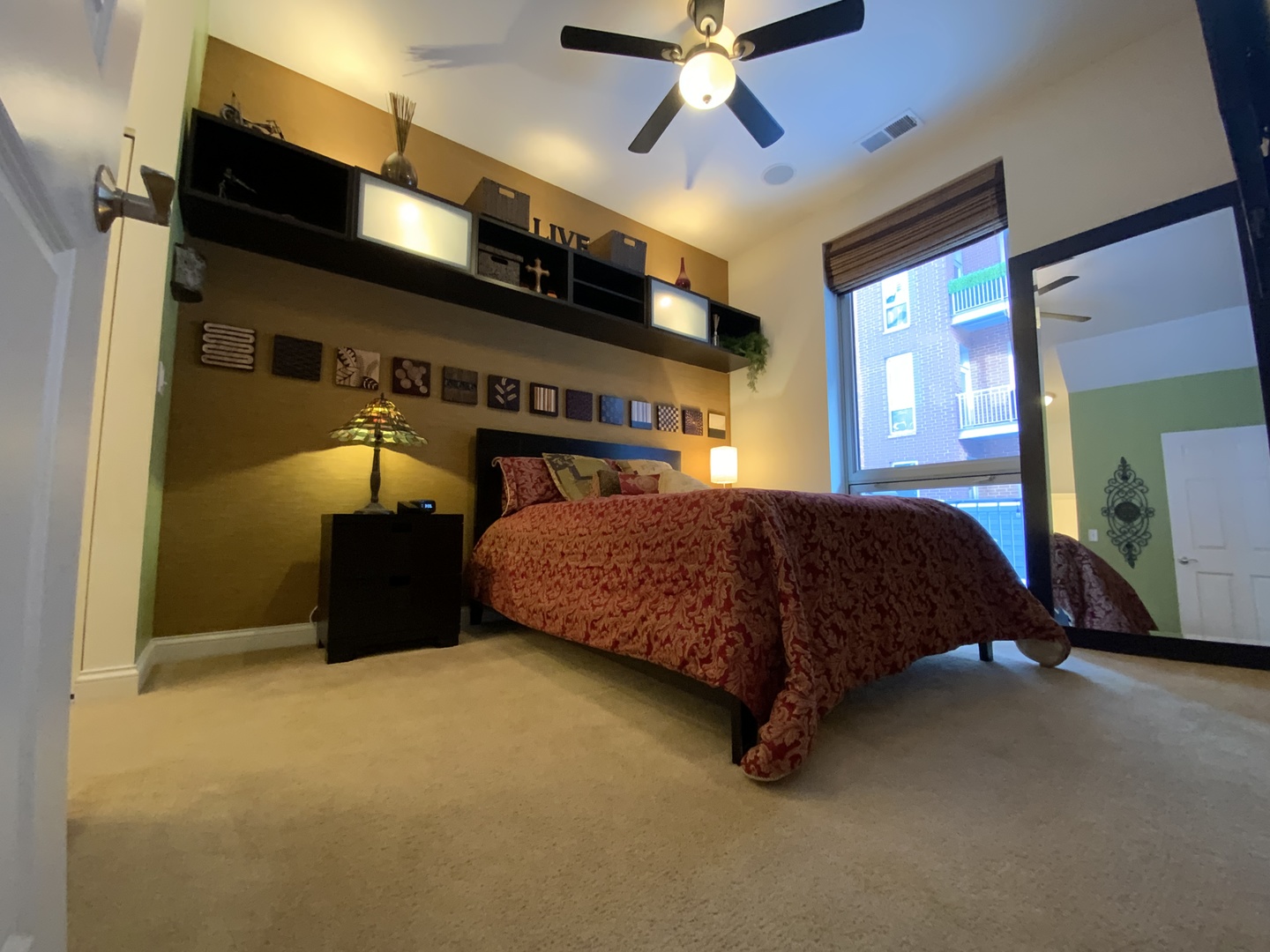 2025 South Indiana Avenue, Unit 209 Chicago, IL 60616 - Photo 26 of 49 a bedroom with a bed and a ceiling fan