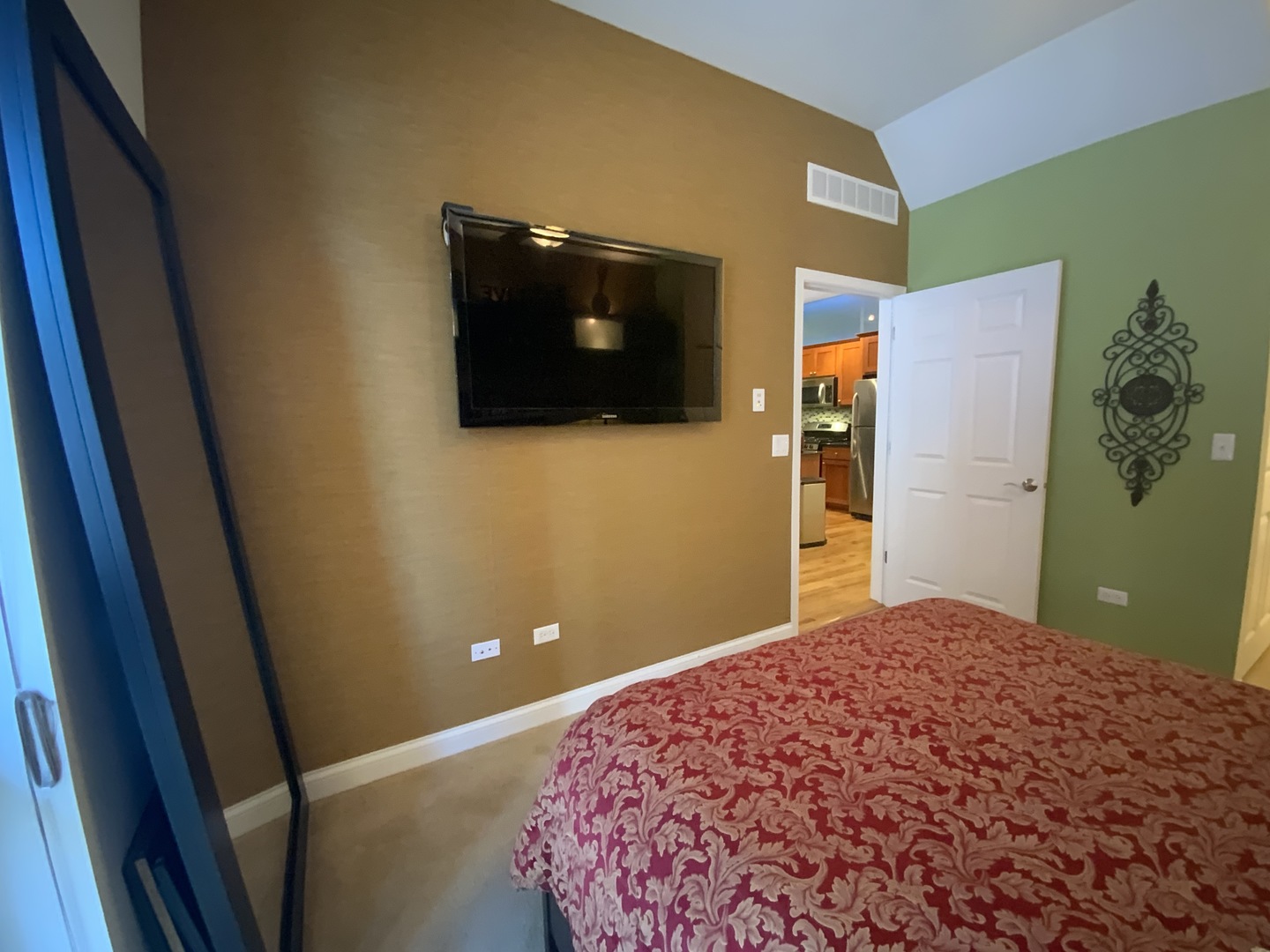 2025 South Indiana Avenue, Unit 209 Chicago, IL 60616 - Photo 27 of 49 a bedroom with a bed and a flat screen tv